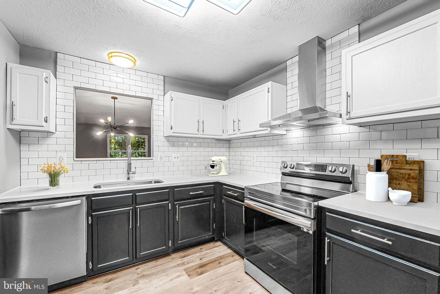 Priced To Sell Fast! Hot Updated 3 Level End Unit Townhouse, Spacious Kitchen with QUARTZ Counters, Stainless Steel Appliances, Modern Tile Backsplash, Spacious Bedrooms, New Custom Paint, Updated Bathrooms, New Flooring, New Lighting, Fireplace, Much More!! Close to Schools, Shopping, and Commuter Routes. This Will Not Last!