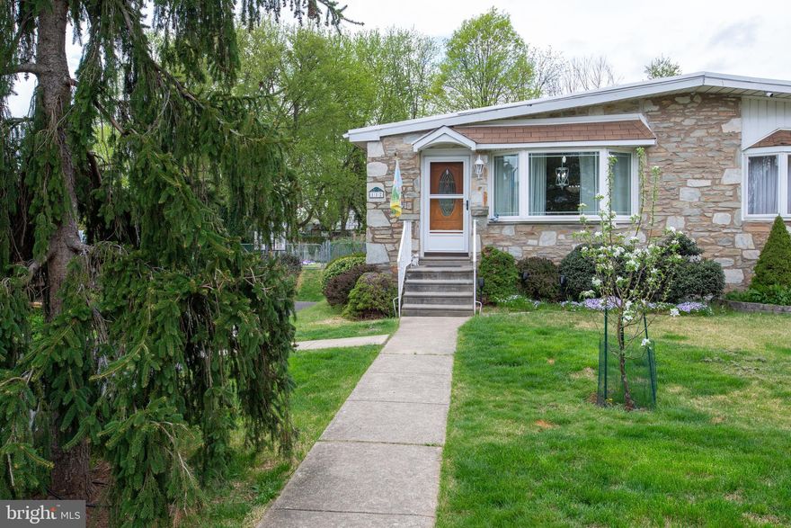 Welcome to this bright and sunny  twin home on a cul-de-sac street!  Nice deep lot with a fenced in yard in the rear for kids or pets, with trees in the rear and grape vines, raspberry bush, and apple trees in bloom! There is a garage at the end of the shared driveway and street parking.  Inside you will find hardwood floors,  replaced six panel doors,  three bedrooms with the third bedroom leading to a large rear room that could be a fourth bedroom or a family room.  The back room has a door to the outside and electric baseboard heat.  Downstairs you will find a finished space with newer LVP flooring that includes a large family room, office space, laundry, plenty of closet space and an outside exit.   The central air conditioning,  hot water heater, and furnace are new in 2020.