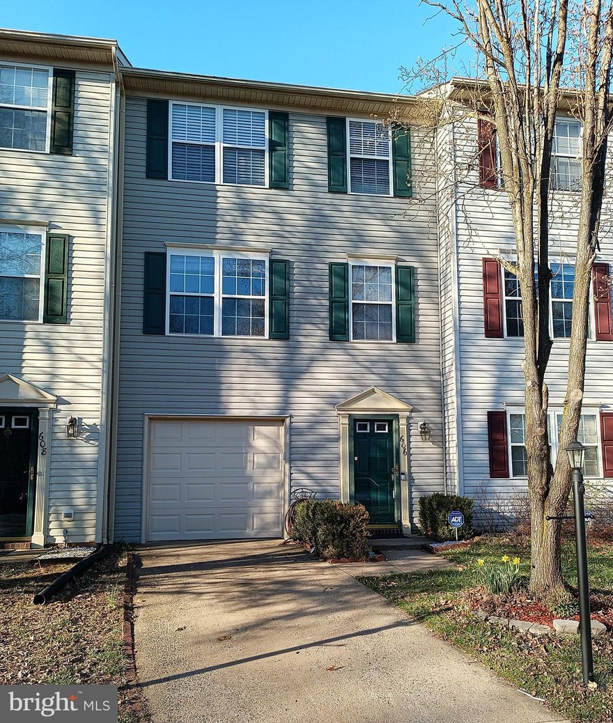 Gorgeous 3 level,  2 bedroom, 1.5 bathroom townhouse located in Charlestown Commons. Vaulted ceiling in freshly painted primary bedroom.  Spacious kitchen with center island, newer dishwasher and microwave. Walk out onto  large deck overlooking fully fenced in backyard.  Fireplace and upgraded flooring in the living room.  New flooring in finished basement and bedrooms. Jacuzzi tub, upgraded shower and fresh paint in Jack & Jill bathroom.  One car garage, with  driveway, and  3 additional spaces.  Newer garage door. Tot lot.  Minutes from 95, route 1, VRE, downtown Fredericksburg, shopping, and dining.