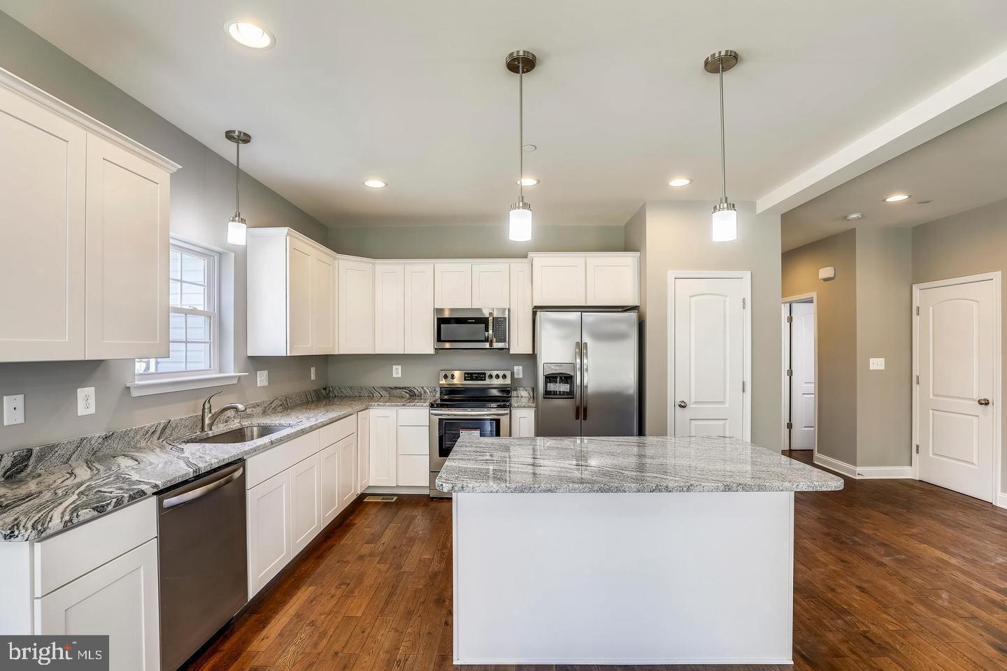 TO BE BUILT! Nestled within a well-established community with mature trees and open green space right across the street, this brand-new Platinum Package Magnolia home offers the charm of a traditional neighborhood with the comfort of modern living. This upgraded model will include a finished basement and enhanced amenities for elevated living. A welcoming front porch and partial brick exterior create instant curb appeal, while a two-car garage with individual doors and openers adds both style and convenience. Step inside to find engineered hardwood flooring flowing throughout the main level, a private study with French doors, and a spacious family room centered around a propane fireplace with black slate surround and craftsman mantle. The open staircase features elegant oak railings with wrought iron balusters, leading to an upper level designed for convenience and comfort. Upstairs, the owner’s suite showcases a tray ceiling, spa-like bath with a soaking tub and separate shower, while the additional bedrooms are served by bathrooms finished with 12x24 ceramic tile surrounds. A second-floor laundry and dual-zoned HVAC system add everyday ease. The fully finished, walkout lower level offers even more versatile living space to suit your lifestyle, featuring a private bedroom, full bathroom, and open areas perfect for entertaining, recreation, or guest accommodations. With HOA fees of only $48/month, up to $30,000 in builder incentives with preferred mortgage and title companies, and a 10-year limited structural warranty, this home is a rare opportunity. Conveniently located near Rt. 301/50 & Rt. 214 (Central Ave.), you can be anywhere you need to be in minutes. Built by a trusted local father-and-son team with more than 50 years of experience, Magnolia Homes is known for quality craftsmanship and attention to detail. If possible, please schedule your showing between Tuesday and Saturday from 12:00 to 5:00 p.m., when our helpful community manager will be on site to assist you.