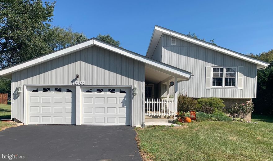 Fantastic spacious 4 BR/2.5 BA, 3 level split level home with a strong contemporary flair. Located close to shopping, dining & numerous medical facilities yet no city taxes. Very close to Hagerstown Community College, Meritus Medical Centre and just a couple miles from I70.  Setting on a corner lot in a well-established, mature neighborhood which is in the desirable Smithsburg Middle and Smithsburg Hish School District.  Home features an open foyer, formal sunken living room with vaulted ceiling and exposed beams, formal dining room, eat in kitchen w/ oak cabinets, granite counter tops and new black slate appliances.  There's glass sliding doors leading to the rear large deck which offers a tiered smaller level deck off the back and stairs down to the patio.  The upper level offers primary bedroom w/ full on suite w/a brand new large walk-in shower, 2 additional bedrooms, a full hall bath w/ jacuzzi soaking tub. There's access to two separate floored attics offering tons of storage options.  In the lower level there's a large family room w/ fp and brick hearth.  Sliding glass doors to the rear patio.  There's a 4th BR/office/den (your choice) w/ access to crawl space, half bath, laundry rm/ furnace rm w/ walk out exterior side door, additional utility closet where the oil tank, electric panel box and hot water heater are located.  A wonderful oversized 2 car front loading garage and big driveway to park 4+ vehicles. Attractive newer vinyl siding, all windows have been replaced and kitchen sliding door has been replaced, upgraded 40 yr GAF architectural shingle roof was installed 7 yrs ago.  Seller has added a home warranty with Cinch Home Services with $100 deductible.  Said warranty covers the seller until settlement then converts to a buyer's home warranty for 1 year.  Buyers can add extra optional coverage to the warranty at their cost within 30 days from settlement.