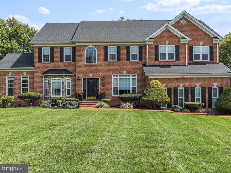 From the brick lead walk to the formal center hall entry, the souring ceilings in the family room and large entertainment centered kitchen and morning room, this home just beckons class and style.  Features of the home include large formal living and dining rooms, sun filled side solarium, hand crafted curved staircase, rear stairs, two sided LP fireplace between solarium and living rooms, stone wood burning fireplace and mantle in family room, true hardwood flooring, ceramic tile with accents in foyer, tray ceilings, and extensive trim.  The balcony inspired upper level features hardwoods and five bedrooms.  There is a jack and jill access bath, an upper level laundry, secondary ensuite, and a primary bath that will make your head spin with private sitting area, LP fireplace, spa style bathroom with walk in shower and jetted tub, all overlooking the formal entry.  The basement is an entertainers delight featuring a bar area, wall mounted fireplace, gaming area, and large media room.  There is a private hall to the full bath, storage areas, and utilities rooms.  Outside, enjoy a multi level deck, patio firepit area with pergola, a very large party inspired pool area with stone retaining walls, and concrete decking suitable for large numbers of entertainment seeking guests, all overlooking the community pond.  Additional outdoor amenities include a private hot tub and outdoor storage.  Home sits conveniently towards the front of the community and directly beside the community walking path.  The rear yard is fenced and the entire yard is very nicely landscaped with water and mountain views.  There is storage under the decks leading to the walk out basement doors.  This home is truly a one of a kind in the classic Charles Town community of Eastland.