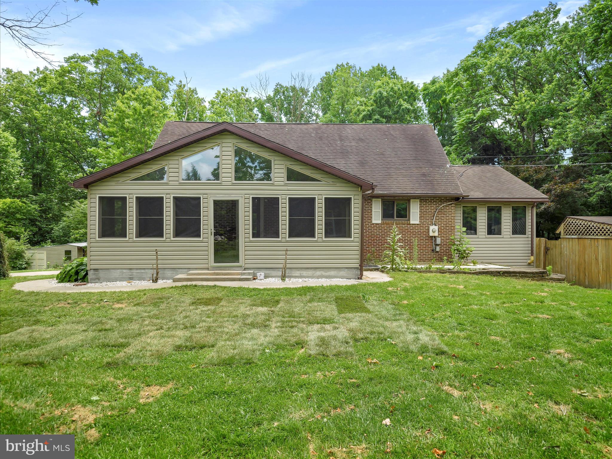 Nestled on nearly 2 wooded acres in the serene Potomac Heights community, this custom-built contemporary home offers a perfect blend of comfort and functionality—ideal for car enthusiasts and those seeking a private, nature-filled setting. transitional-style residence offers a perfect blend of comfort and sophistication. Built in 1976, this charming home has been thoughtfully designed to cater to modern living while retaining its timeless appeal. With 2,716 square feet of fully finished space, it invites you to experience a lifestyle of luxury and ease. Step inside to discover a warm and inviting atmosphere, where every detail has been meticulously curated. The heart of the home is undoubtedly the updated kitchen, equipped with stainless applances and new countertops, that elevate your culinary experience. Imagine preparing meals with ease using the self-cleaning electric oven while the built-in microwave and dishwasher ensure convenience at every turn, making this kitchen a true chef's delight. Natural light pours in through thoughtfully placed windows, enhancing the inviting ambiance throughout the home. Retreat to the three well-appointed bedrooms, each offering a tranquil escape from the hustle and bustle of daily life. The fully finished basement provides additional space for recreation or relaxation, perfect for movie nights or a cozy reading nook. The exterior of the home features a classic brick and vinyl siding combination, exuding curb appeal and durability. An attached garage with inside access ensures that you can easily transition from your vehicle to your home, regardless of the weather. The expansive layout and outdoor space provide ample opportunities for creating your own personal oasis. Whether it's a garden, patio, or outdoor dining area, the possibilities are endless. This residence is not just a house; it's a place where memories are made and cherished. With its luxurious appliances and thoughtful design, it offers an exclusive lifestyle that balances elegance with everyday comfort. Experience the joy of coming home to a space that truly reflects your aspirations and desires. Call to schedule your private tour today!