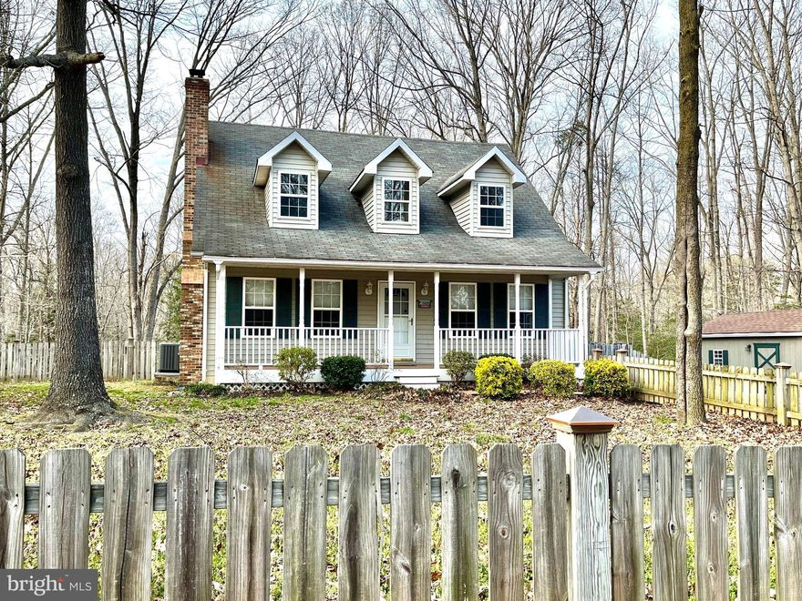 MUST SEE! Turn Key Cape Cod on wooded lot that backs to the protected Chestnut Land Trust. Large paved driveway leads to fenced in front yard with fire pit area with benches and desirable covered front porch.  3 bedrooms and 2.5 bathrooms include main level master suite, main level laundry with upstairs laundry chute,  and expansive closet and storage space throughout all 3 levels. Kitchen/Dining Room combo with Stainless Steel Appliances. Fully finished multi-room walk out basement with locking storage area.  Backyard boasts deck overlooking panoramic views of natural wooded area ready for private outdoor entertaining.