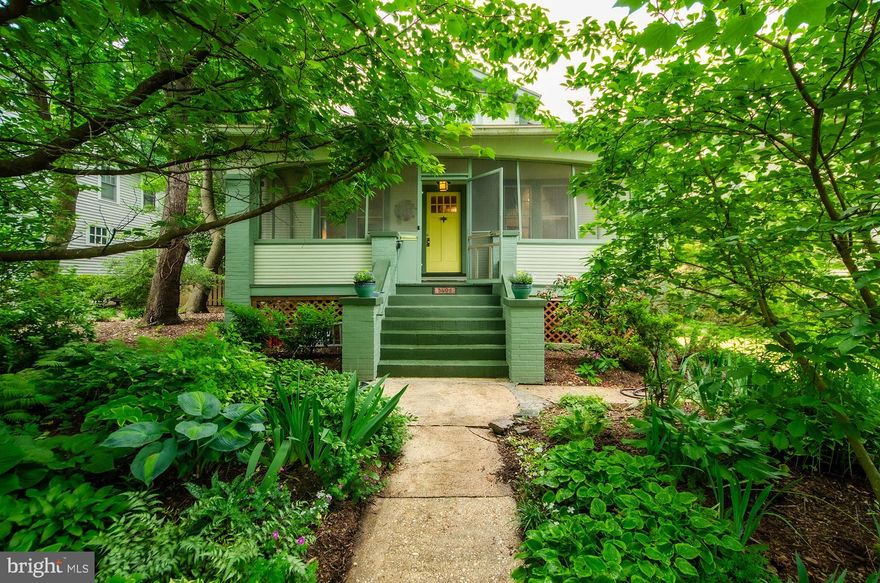 Pull on the Heart Strings Charm! This enchanting, 4 bedroom, 3 bath, circa 1925 Arts and Crafts bungalow has been seamlessly expanded with a two level addition to offer all the conveniences for today’s modern lifestyle while retaining the period charm and ambiance of a bygone era. Step in from the inviting “ice tea sipping” screened front porch to find many hallmark period features to include appealing craftsman trim details, handsome hardwood floors, a cozy fireplace with built-in shelving surrounds, columned room dividers, toasty radiator heat, and abundant sizable windows throughout.  Once inside, you will find a welcoming entry foyer, sweeping living room, separate dining room, a handy main level bedroom and bath, main level family room addition and expanded chef’s kitchen with breakfast/casual dining area. Both the family room and breakfast room open onto the extensive back deck-a perfect spot for outdoor relaxation or dining al fresco. The expanded upper level features lovely tree house views, 3 additional bedrooms including a primary bedroom addition with adjoining 3 season sitting room, ensuite bath and 2 step-in closets, playful roof lines, skylight, oversized windows, enchanting nooks and crannies, and a whimsical bedroom level attic laundry/storage room with sunny dormered windows and extensive closet space.  The partially finished lower level offers ample overflow space for gaming, exercise, and hobbies and comes complete with a rough in for a full bath, separate entrance and abundant storage.  Enjoy the copious rumpus/storage space as it currently is, or let your inner “HGTV” vision reimagine to your heart's content!  All nestled on an exceptionally large 10,200 sq ft level garden lot chock full of a lifetime’s worth of green thumb garden tending. The  relaxing deck, screened porch and fantastical playhouse offer plenty of spots for outdoor enjoyment.  Don’t miss the sizable detached garage. This commuter’s haven is located just blocks from Metro and all the wining-and-dining entertainment options along the vibrant Ballston/Clarendon Orange line corridor.  Sited on a gorgeous street in the Norman Rockwell-esque neighborhood of Ashton Heights/Lyon Park with its shady tree lined streetscapes, a myriad of charming period homes and nearby parks. Come see why this neighborhood is so popular with today’s home buyers!