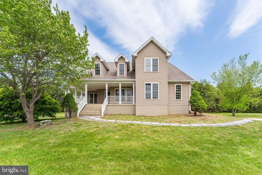 This lovely renovated Colonial with a wrap-around porch and main level owner's suite is ready for new owners! Features include: Main Level Owner's Suite with large bath and walk in closet; extensive hardwood floors on the main level newly refinished; updated kitchen with new cabinets, counters, and appliances; New carpet; large vaulted family room with fireplace; large vaulted screened porch; 7 acre lot perfect for entertaining; unfinished basement, new hvac, and much more!