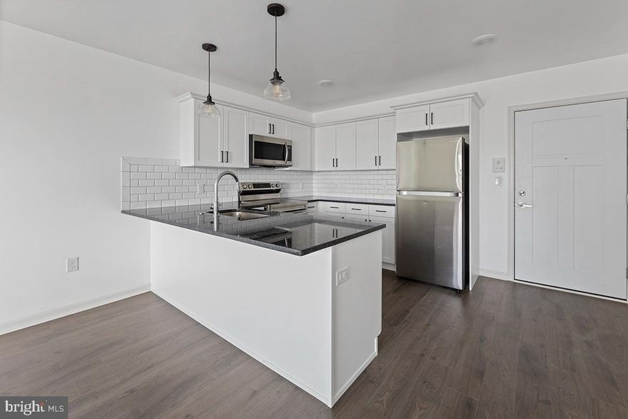 Available December 1st! Charming top-floor 1-bedroom home at The Wright in Roxborough. This modern apartment home offers an open-concept living/kitchen space with granite countertops and stainless steel appliances. Enjoy wood-inspired flooring, in-unit Washer/Dryer, and PTAC climate control for personalized comfort. Residents can access the green roof deck and off-site fitness center at no additional charge. Plus, The Wright is 100% pet-friendly with no extra fees. Apply today!