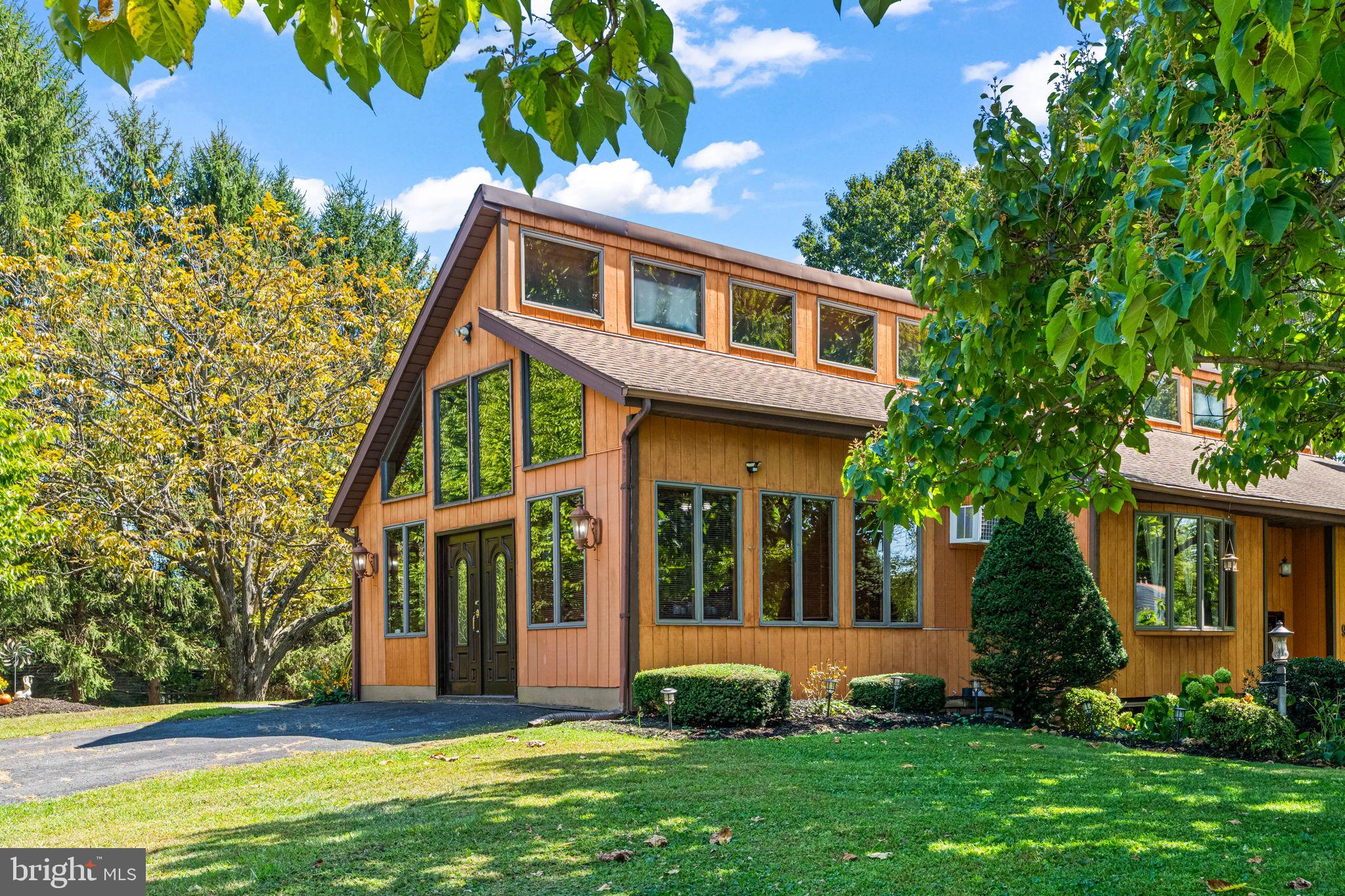 Welcome to your stylish country retreat! This beautifully maintained Country/Contemporary-style single-family home offers the perfect blend of open-concept design, natural charm, and versatile space — all set on a spacious corner lot in a peaceful rural setting still just minutes from all amenities.
Inside, you’ll find 3 bedrooms and 2 full bathrooms, including a primary bedroom with direct access to the deck for morning coffee or evening relaxation. The heart of the home is the expansive family room, featuring soaring wooden cathedral ceilings and abundant natural light — perfect for cozy nights in or hosting family and friends.
The finished lower level offers even more living space with a second family room, dedicated laundry/workshop area, and an additional bonus room ideal for a guest bedroom, craft room, or in-home office — you decide!
Step outside to enjoy the best of country life on the full-length wooden rear deck, accessible from both the kitchen/family room and primary bedroom. With plenty of room to relax, entertain, or fire up the grill, this outdoor space is made for enjoying quiet mornings and starry nights.
And for those dreaming of a hobby farm or just wanting a bit of rural flair, the outbuildings are perfect for gardening tools, chickens, or whatever your chic farm-life vision entails.
Your modern country lifestyle starts here. Don’t miss this rare opportunity — schedule your private tour today!