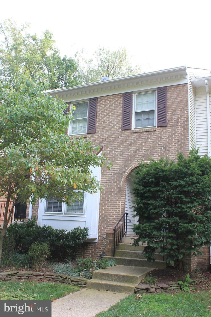 Very well-kept TH one mile to Van Dorn Metro! Bus at end of street, or short stretch 'o the legs!  One of the best rentals you will see!!! Backs AND Fronts to woods, covered Front Entry, Nice Tiled Foyer, Hardwood flrs Main & Lower.  Reno'd Kitchen w/ 42" Maple Cabs, Corian, SS Appliances Including French Door Refrig.  (one white appl).  Nice 15x15 Deck overlooking dense Woods.  Generous BR's, w/ new carpet scheduled next week.  2 Walk-in Closets.  Replacement Windows and Upgraded Blinds.  Brand new TOP washer/dryer.  Laundry Sink.  Wood fireplace in Lower Level - which also walks out to slate patio.  Just a superb property!  Owner will credit up to $800 toward first month's rent for quick occupancy!