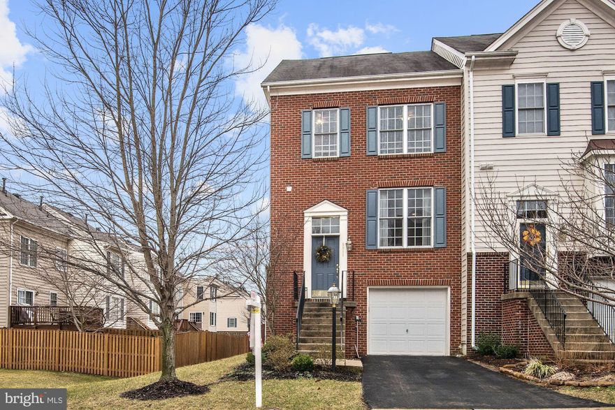 End unit garage townhome, great location near commuting routes and Manassas VRE stations. Stunning kitchen upgrades with granite, gorgeous white cabinets, white appliances, and gleaming wood floors. Gas cooking! Three level bump-out options for extra space. Filled with natural, refreshing sunlight from end unit and large bay windows! Vaulted ceilings in upstairs bedrooms. Fenced backyard for extra privacy plus upper level deck and lower level patio for outdoor enjoyment!