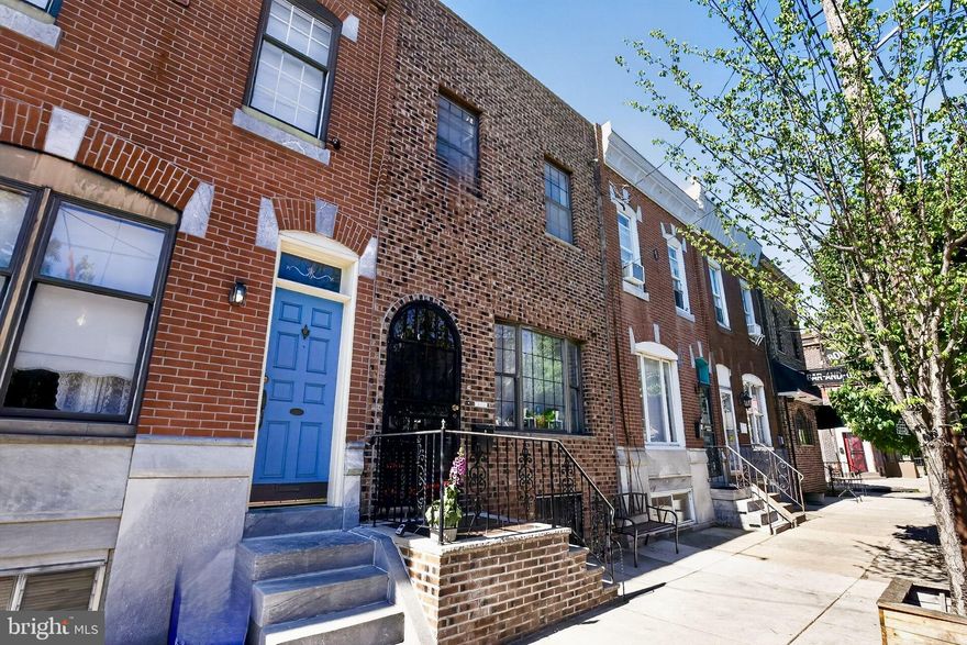 Here, in  South Philly's East Passyunk neighborhood, the Old World meets the new.  You'll be hard pressed to find another home that melds the nostalgia of yesteryear so seamlessly with the modern conveniences of today!  This house has been lovingly and thoughtfully updated by its current owners to retain its original warmth and character.   Its handsome brick facade and arched doorway lead into a protected vestibule with stately front door that lets you know immediately that you've found something special.  Enter into the spacious living area and the first thing you'll notice is the gleaming hardwood which graces the floors throughout the home.  Accented by the original wooden stair banisters the living area blends effortlessly with the formal dining area.  Here you'll also find a half bath, a rare convenience in a home of this vintage.  Wander further and you enter the heart of the home, an inviting eat-in kitchen with space for Sunday dinners, abundant espresso wood cabinetry and an expanse of counter space.  The kitchen has been graciously updated with tile counters, glass backsplash and SS appliances.  There are also sliding glass doors which let in loads of natural light while also providing easy access to the recently redone back yard with patterned concrete patio and wooden privacy fence.  Head down the open staircase to the basement level and you're in for a treat.  The basement is fully finished with sleek engineered hardwood floors, recessed lighting and a neutral gray and white palette.  Currently used as a family/playroom, this level is multi-functional and could also serve as a work out area, home office or barroom/entertaining space, you decide.  Behind folding doors, there's a well proportioned, bright laundry room with plenty of storage and a utility closet.  The basement also has two other large storage closets and a workbench for your home improvement projects.  Head up to the 2nd floor and the sense of nostalgia continues with original wooden crown moldings, baseboards and door frames.  The vintage style hall bath has been impeccably updated with new tile and sparkling fixtures.  On this level, there are also 3 large, charming bedrooms with excellent closet space, all painted in soothing tones. Top this off with recently installed AC split systems, a brand new furnace and ceiling fans in every room and you have the perfect abode!  This vintage inspired, yet contemporary home is conveniently located to public transportation, the sports complex and is walk-able to the world class restaurants and shopping on East Passyunk and the historic Italian Market.  See it today! This one won't last!  SHOWINGS START AT 3PM ON FRIDAY, MAY 15TH.