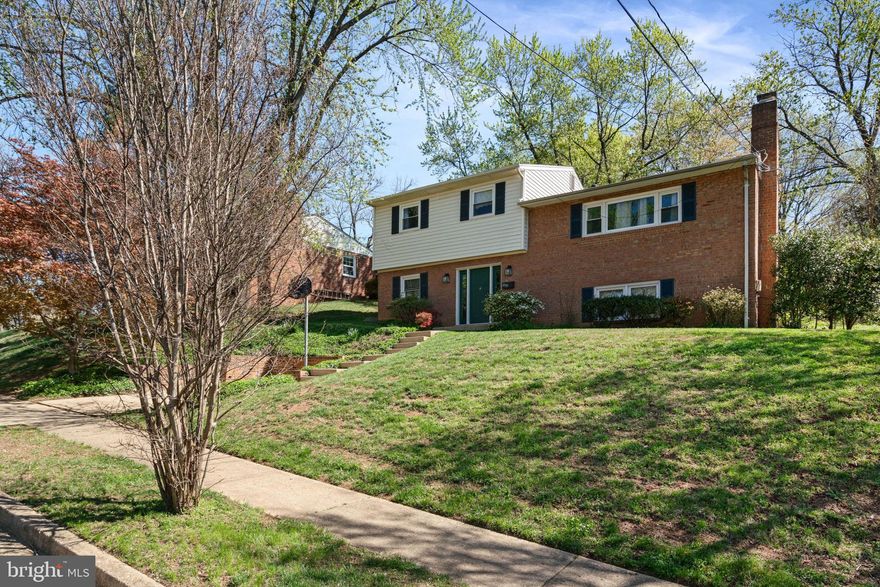 "WELCOME” HOME to this beautifully maintained 4-level split in the heart of Falls Church! This spacious single-family home offers 4 bedrooms, 3 full baths, and nearly 2,500 sq ft of living space with a versatile floorplan ideal for modern living. The main level features a bedroom & office/den with custom built-in shelving and a full hall bath. A double staircase leads upstairs to the updated kitchen, showcasing sleek stainless-steel appliances, granite countertops, and ample cabinet space. The bright and inviting family room boasts a large picture window that fills the space with natural light, rich hardwood floors, and a cozy wood-burning fireplace. Enjoy formal dinners in the elegant dining room or step through sliding glass doors to the screened-in porch and expansive, fully fenced backyard with a stone patio—perfect for outdoor gatherings and relaxing evenings. The upper level features the spacious primary suite with a full ensuite bath. Plenty of room for family and guests with two additional bedrooms and a second full hall bath. The lower level offers a generously sized rec room with a second wood-burning fireplace, ideal for movie nights, a game room, or a play area. The location is unbeatable, with quick access to major commuter routes including I-495, I-66, Route 50, and Route 29, as well as nearby Metro stations (West Falls Church on the Orange Line and East Falls Church on the Silver Line). You’re just minutes from the shops, dining, and entertainment of Tysons Corner and the Mosaic District—all with NO HOA. Don’t miss your chance to make this exceptional home yours—schedule your tour today!