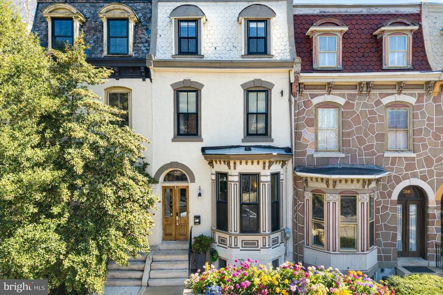 Extra-wide renovated Fairmount home with roof deck views, large patio, and 3 years remaining on the tax abatement. Sun-filled with generous proportions and excellent natural light throughout, this beautifully updated 3-bedroom, 3 full and 2 half bath home offers a rare combination of historic character and modern comfort. Additional highlights include a fully finished basement with media room and home gym, two-zone HVAC, and hardwood floors throughout. The extra-wide footprint—rare for classic Fairmount homes—creates open, comfortable living spaces across every level.

Soaring ceilings and a west-facing bay window fill the first floor with natural light. The open layout flows from the living room to a spacious dining area and into the beautifully designed kitchen, featuring a waterfall quartz island, glass subway tile backsplash, and premium stainless appliances. Double glass doors open to the large sunny patio, ideal for summer BBQs and easy indoor-outdoor living. The patio includes a custom shed ideal for storing bikes and trash cans, along with beautifully crafted custom fencing.

The second floor offers two generous bedrooms, each with walk-in closets and private tiled baths, along with a hall laundry room.

The third floor is dedicated to the primary suite, with a spacious front bedroom, marble bath with soaking tub, glass shower, and double vanity, and a bright walk-in closet with built-in organization. At the rear, another room—currently used as an office—features a wet bar and powder room and leads to the incredible roof deck with sweeping 360-degree views, pergola, and plantings.

The finished basement adds flexible living space with a media room, home gym, and additional storage.

Built in 1876 during the nation’s 100-year anniversary celebration of the signing of the Declaration of Independence, this Centennial-era home blends historic character and proportions with the comfort and ease of a modern renovation.

Just steps from Kelly Drive, Fairmount Park, museums, Whole Foods, neighborhood restaurants, shops, public transportation, and Center City, in the heart of one of Philadelphia’s most beloved neighborhoods.