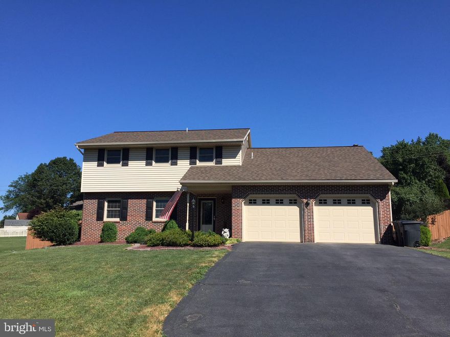 A must see...this meticulously maintained and updated 2 story offers privacy and space.  recent siding, windows, roof, quartz counters, appliances, septic system and more! The hardwood and tile floors on entire first floor are amazing. Enjoy the sunroom, and private backyard. 1.5 baths on first floor make clean up from outdoor or garage work a breeze. The lower level has flooring and painted walls ...great play or hobby space. This conveniently located 2 story is move in ready.Back yard is being seeded...rock being removed, top soil added and seeded.