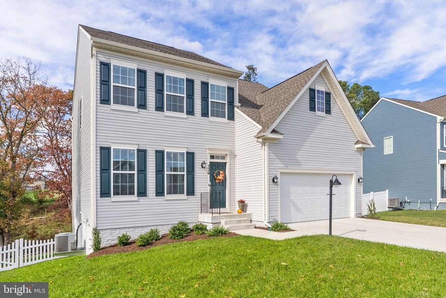 Welcome to 326 Lehigh Drive, a stunning, like-new home in a prime Winchester location—a pristine, only 2-year-old residence that feels brand new! This beautiful 4-bedroom, 2.5-bathroom home boasts exceptional high-end finishes and a modern, desirable design throughout. The interior showcases an airy open-concept layout and a stylish neutral color palette that allows any decorating style to flourish. Step onto the luxurious hardwood-style flooring that flows seamlessly across the main level, enhancing the expansive feel of the generous room sizes. The heart of the home is the chef's kitchen, which features not only sleek stainless steel appliances but also beautiful upgraded countertops, a large central island perfect for gathering, and a dedicated pantry. The upper level is designed for comfort and privacy with four large bedrooms. The primary suite includes a spacious ensuite bathroom with luxurious, custom fixtures and tiling. An additional full bathroom with high-end finishes and elegant appointments serves the remaining bedrooms. For ultimate convenience, the laundry room is also thoughtfully located on this upper level. The home offers a perfect blend of indoor comfort and outdoor retreat. Step outside to find truly exceptional living spaces, starting with a beautiful screened-in deck featuring stylish wooden vaulted ceilings—your ideal spot for enjoying the outdoors rain or shine. The deck also features an uncovered area for sunbathing and relaxation, complemented by a lower patio that provides even more versatile space for entertaining. The yard is fully fenced-in, offering privacy and security, and a large walkout basement provides incredible potential for future customization or storage. Situated in a great location on the east side of Winchester, this home is just minutes from major commuter routes, shopping centers, excellent schools, and more, offering the perfect blend of modern luxury and unbeatable convenience.