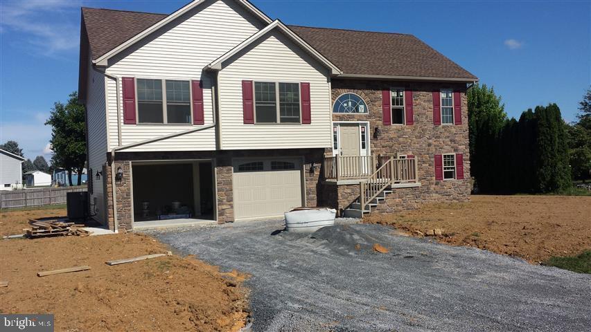 Recently built home featuring large family room, living room with vaulted ceiling, 3 bedrooms, 2 baths, kitchen, laundry room, covered rear patio and nice sized deck with oversized 2 car garage.