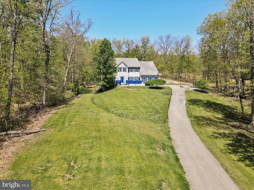 This stunning home, nestled on nearly 4 acres, is the perfect retreat you've been searching for. From the moment you step inside, you'll be captivated by its abundant amenities and spacious layout. The main level features a grand two-story foyer, elegant formal living and dining rooms, a kitchen equipped with new stainless steel appliances and an attached breakfast room, a convenient half-bathroom, laundry room, and a generous sunken living room with a cozy gas fireplace. Upstairs, the luxurious master suite includes a large walk-in closet and a private full bathroom with a soaking tub and separate shower. Three additional bedrooms and another full bathroom complete the upper floor. The finished basement offers even more living space with a full bathroom, a family room, and a recreation room, perfect for entertainment or relaxation. Outside, the expansive deck is ideal for hosting family and friends, while the above-ground pool provides a refreshing escape on warm days. This property truly has it all, offering both comfort and elegance in a serene setting. Call today to schedule a tour!