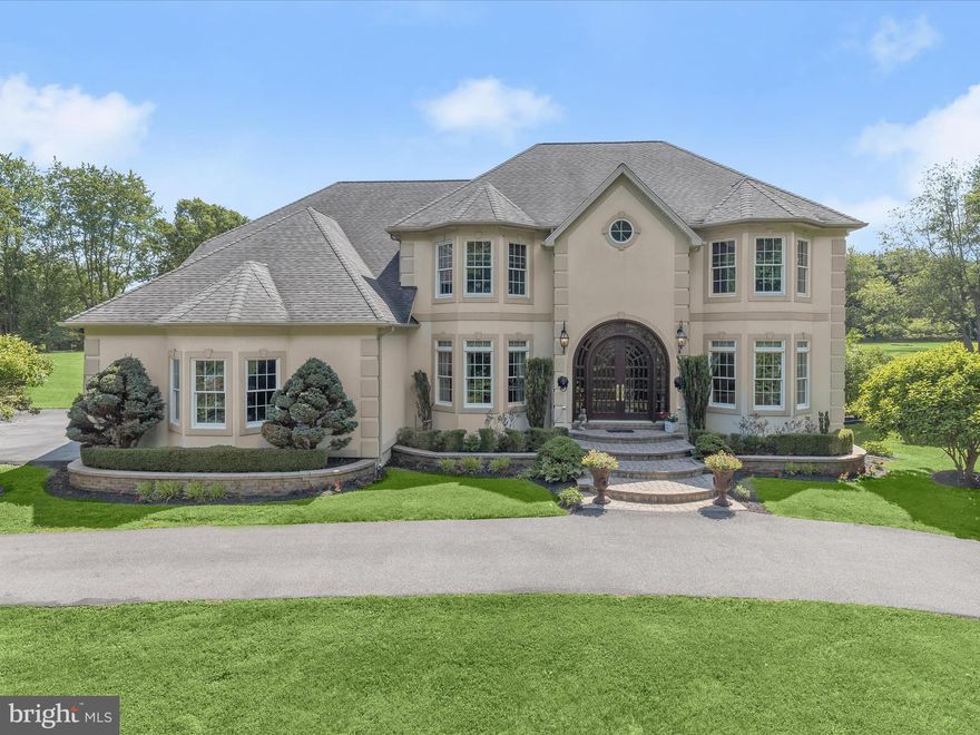 Nestled on 4.42 serene private acres in the coveted Kings Gift community, this exquisite estate epitomizes luxury and elegance. The property is adorned with spectacularly manicured grounds, lavish gardens, an incredible pool, and a phenomenal outdoor entertainment paradise, perfect for hosting gatherings or enjoying tranquil moments. A custom Palladian double door welcomes you into the grand foyer, where elegant lighting, a soaring ceiling, and curved stairs set a tone of refined opulence. The adjacent formal living and dining rooms, graced with intricate molding and light-filled windows, provide an ideal setting for entertaining guests. At the heart of the home lies a kitchen that is a true chef’s delight, featuring a professional-grade six-burner gas stove, double oven, prep sink, Sub-Zero refrigerator, two disposals, an ice machine, island, breakfast bar, display cabinetry, and a pantry. Savor your morning paper by one of the three fireplaces or step outside to the veranda with your tea. The family room, with its second fireplace, two ceiling fans, and double doors leading to the veranda, offers a cozy yet sophisticated retreat. A convenient main-level ensuite bedroom doubles as an optional office, while a full bath for bathing animals and a powder room add to the main level's functionality. Ascend one of two staircases to discover the sprawling primary suite, adorned with a double-sided fireplace, a sitting room, two sizable walk-in closets, and access to a private balcony. Three additional spacious bedrooms, each with ample closet space, an ensuite bath, a full bath, and a laundry room complete the upper level. The lower level has been framed and sheet rocked, ready to accommodate multiple additional rooms and a full bath, providing endless possibilities for customization. This home, with its resort-style amenities and remarkable design, offers an unparalleled living experience in the heart of Kings Gift.