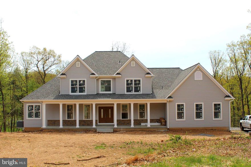 Experience the perfect balance of elegance, comfort, and modern farmhouse charm in this exceptional new construction home designed to elevate everyday living. Welcome to a residence that blends timeless farmhouse character with modern-day luxury. This beautifully designed home offers 3,626 square feet of thoughtfully crafted living space, featuring 4 bedrooms, 3.5 baths, and a 2-car garage. From the moment you arrive, you’ll be captivated by the inviting farmhouse architecture accented with a striking greystone highlight across the front façade, creating curb appeal that’s both classic and unforgettable. Set on a private, elevated lot surrounded by mature trees, this property offers the perfect mix of serenity and sophistication.

Inside, the home is rich with luxury details and versatile spaces. The main level includes a master suite with walk-in closet as well as a guest suite, offering comfort and flexibility for family or visitors. Upstairs, a second master suite ensures privacy and convenience, while additional bedrooms and a loft create ample living space.

The heart of the home is the open-concept kitchen, designed for both entertaining and everyday living. Featuring a large island, walk-in pantry, and a wet bar/kitchenette, it flows seamlessly into the great room and family room, all enhanced by vaulted ceilings and a cozy gas fireplace on the main level. Additional rooms include a dedicated office/den, sunroom, main-floor laundry, and flexible unfinished future space—perfect for storage or expansion.

The home also offers unique lifestyle amenities, including a potential wine cellar, a side-entry garage, and multiple outdoor living areas: a covered front porch, rear porch, balcony, screened porch, courtyard, sundeck, grill deck, and potential for an outdoor fireplace—ideal for gatherings in every season.

This home is more than just a place to live—it’s a farmhouse retreat where luxury, comfort, and timeless design come together on a truly one-of-a-kind lot.