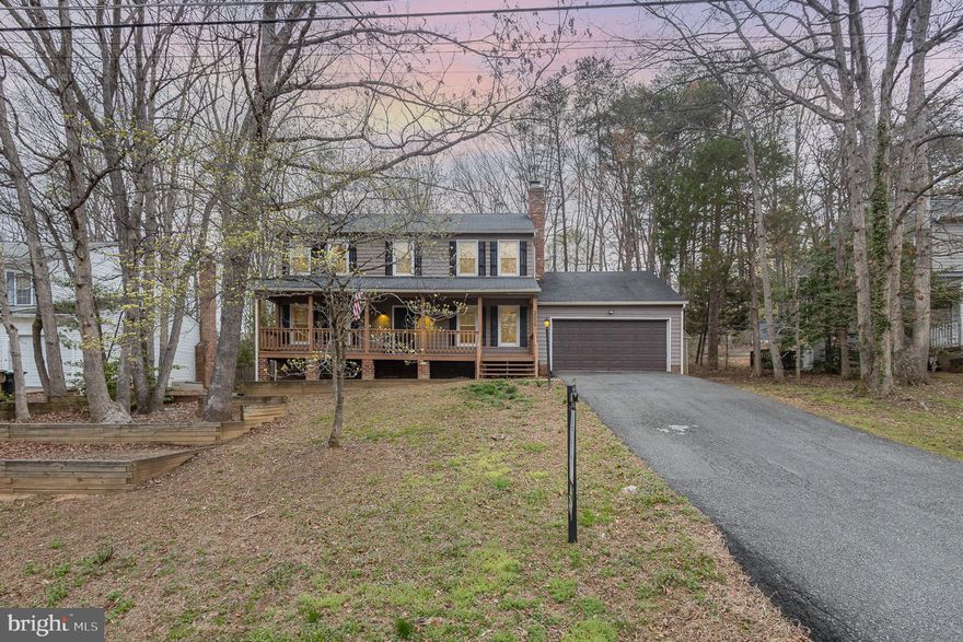 ***VETERAN ASSUMABLE 3.125% LOAN, $297,699 Balance, Carrington Mortgage***Value Priced 4BR, 2.5BA, 2 Level Colonial on Level Lot & Driveway in Amenity Filled Aquia Harbour! This Home is only ONE Minute from Aquia Harbour Back Gate and an EASY Commute to Quantico!! Highlights & Features Include: Wide Plank Cherry Hardwood Floors and Ceramic Tile Floors throughout Main Level! Family Room w/Wood Burning Fireplace w/Brick Hearth & Surround & Wood Mantle; Kitchen w/Granite Counters, Raised Panel Cabinetry, Stainless Steel Appliances, Updated Light Fixtures & Pantry; Living & Dining Room w/French Doors to Rear Deck; Half Bath w/Granite Top Vanity; Laundry Room w/Door to Oversized 2 Car Garage with Workbench & Shelving Complete the Main Level. The Upper Level features the Primary Bedroom w/Carpet, Walk in Closet w/Organizer & Ceiling Fan; Primary Bath w/Ceramic Tile Floors, Granite Top Vanity w/Storage & Step in Shower w/Floor To Ceiling Ceramic Tile Surround; Bedrooms 2, 3 & 4 All w/Carpet, Ceiling Fan w/Light & Closets; Hall Full Bath w/Ceramic Tile Floors, Granite Top Vanity w/Storage & Tub/Shower w/Floor to Ceiling Tile Surround Complete the Upper Level.  Additional Highlights Include Relaxing Covered Front Porch; Tiered Rear Deck w/Stairs to  Backyard; Outdoor Cooking Station w/Granite Counters & Fire Pit Area; Trash Bin Shed; Centurion Whole House Generator, Never Lose Power; Two Car Wide Driveway; 50GAL Water Heater(2011); Vinyl, Double Pane, Double Hung, Tilt in Windows(2017). Aquia Harbour Amenities include: Two Pools; State Certified Police Force; Fire Dept; Marina w/Boat Ramp & Fishing Pier; Kayak/Canoe Launches; Golf Course w/Pro Shop, Putting Green, Driving Range & the World Famous Clubhouse @ Aquia Harbour Restaurant; Dog Park; Horse Stables, Riding Areas/Trails & Pens; Secure Storage Lot; Community Garden; PreSchool; Fishing Park; 8 Other Parks w/Tot Lots, Tennis, Basketball & Abundant Wildlife Including Bald Eagles in the Sky Above! The Harbour also features Great Community Events including Independence Day Celebration w/Fireworks, Oktoberfest, Movie/Game Nights and So Much More!!!!***Offer Submissions Need to be Received by Midnight Sunday Night 4/13 for Review and Response on Monday 4/14***