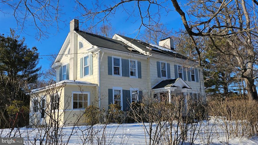 ​This distinctive 4-bedroom, 2½-bath 1790 Colonial offers a rare opportunity to own a truly historic home with modern-day conveniences. Set on a sun-filled 1.83-acre lot, the property combines original architectural character with practical updates for today’s lifestyle.
An elegant entrance leads to generously sized rooms designed for comfortable everyday living and easy entertaining. Authentic exposed timber beams and period mantels reflect the home’s rich heritage. Three fireplaces anchor the main level — located in the living room, dining room, and kitchen — adding warmth and architectural interest. A fourth fireplace is located in the primary bedroom and is currently closed off.
Hardwood floors extend throughout the main level. All three bathrooms have been thoughtfully updated, offering modern finishes while maintaining the home’s historic integrity. A spacious floored attic provides excellent storage and potential for future expansion.
The property also includes a large historic barn and a separate shed, offering flexible space for storage, hobbies, workshop use, or potential adaptive reuse.
Modern infrastructure enhances the home’s livability, including PUBLIC WATER, PUBLIC SEWER, efficient GAS HEAT, and SOLAR PANELS for improved energy efficiency.
With 4 bedrooms, 2½ baths, significant acreage, and preserved 18th-century architectural details, this is a unique offering for buyers seeking historic character without sacrificing essential modern amenities.  Move right into desirable Hopewell, NJ, and enjoy a peaceful, community-oriented setting within the highly regarded Hopewell Valley Regional School District. Residents appreciate a charming downtown, local shops and restaurants, abundant parks and trails, and convenient access to Princeton, Lambertville, New Hope, major commuter routes, and regional amenities — making Hopewell one of Mercer County’s most sought-after locations. An exceptional opportunity to enjoy comfort, convenience, and community — all in a place you’ll be proud to call home.
