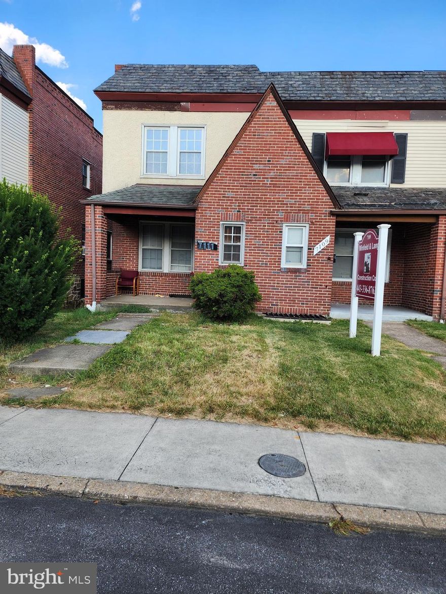 Great opportunity to own a property zoned for commercial & residential purposes. Well maintained end of group porch front Tudor townhome. Large country kitchen w/plenty of cabinets. Large spacious rooms thru-out. Back covered porch. Natural woodwork thru-out.Wood flring. Roof '10, Furnace '07, windows on 2nd lvl '05 & newly painted and new partial carpet. Previously set-up for commercial use