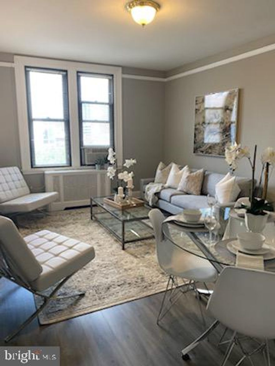 Sun-soaked one bedroom at The Carlyle with new wood-like floors, located steps from Rittenhouse Square! This beautifully appointed home features a custom paint job throughout; generously combined living and dining room filled with natural light; a separate kitchen with sleek wood cabinetry, stainless steel appliances and black tile backsplash; and a spacious bedroom that enjoys excellent closet space and a nearby full hall bathroom with a shower/tub and decorative tiling. The Carlyle is a pet-friendly, doorman building only one block from Rittenhouse Square. Rent includes the security of a 24-hour doorman and use of the building's state-of-the-art gym. Tenants are responsible for paying all utilities, including: electric, gas, water, cable, and internet.