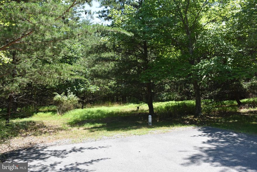 GET AWAY FROM THE HUSTLE AND BUSTLE WITH THIS WOODED BUILDING LOT IN THE PRIME COMMUNITY OF CACAPON SOUTH. THIS LOT IS TUCKED AWAY AT THE END OF A CUL-DE-SAC, WITH PAVED ROADS, UNDERGROUND UTILITIES AND BEAUTIFUL HOMES.  DIRECTLY ACROSS RT. #522 & CACAPON STATE PARK WITH GOLFING, SWIMING, FISHING & HIKING. A NEWLY RENOVATED LODGE WITH GREAT FOOD. TRAVEL TO BERKELEY SPRINGS FOR FINE DINING, SHOPPING, MOVIES OR AN ART GALLERY. BERKELEY SPRINGS WAS JUST RECENTLY NAMED BY USA TODAY AS A TOP 10 SMALL TOWN IN THE USA. ABOUT 2 HOURS FROM WASHINGTON DC & BALTIMORE.  BUILD YOUR PERMANENT RESIDENCE OR WEEKEND GET AWAY AND JUST RELAX. ENJOY NATURE OR THE ABUNDANT WILDLIFE FROM YOU BACK DECK.