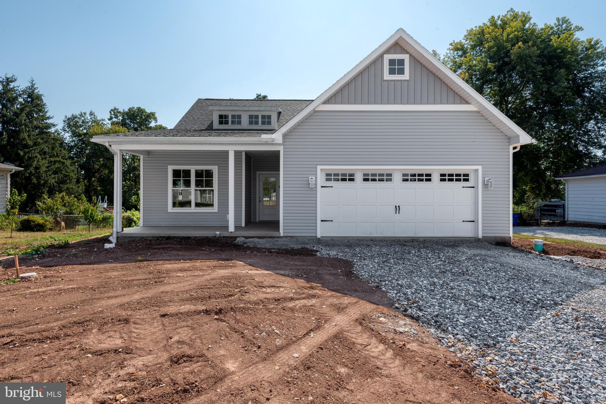 This BRAND NEW, beautiful custom built one-story craftsman style home - IS MOVE-IN-READY!!! Enjoy a simple lifestyle and comfortable living without an HOA and their fees! This location is so close to plenty of shopping & dining and is just within minutes of the new UPMC Hospital. The home boasts 9 foot ceilings throughout with inviting spaces, perfect for your enjoyment and entertaining. Bentzel Building maintains quality craftsmanship both inside and out! You will find Stainless GE appliances, and attractive fixtures by Kohler and Delta!!! A charming front porch welcomes you into this delightful home that offers an open and relaxed floor plan. The modern kitchen, also includes a generous island, pantry with built in wood shelving and laundry room. The dining area and great room flow from the kitchen. A covered back composite deck is perfect to enjoy your morning coffee or a relaxing evening breeze. The primary bedroom is situated with a walk in custom closet and beautiful en-suite including a quartz countertop and large walk in shower. Two other bedrooms provide plenty of space to accommodate your needs. The lovely hall bath is spacious and convenient. Plus the oversized two-car garage adds even more value!!! Schedule an appointment today and make this fantastic home your own!!!