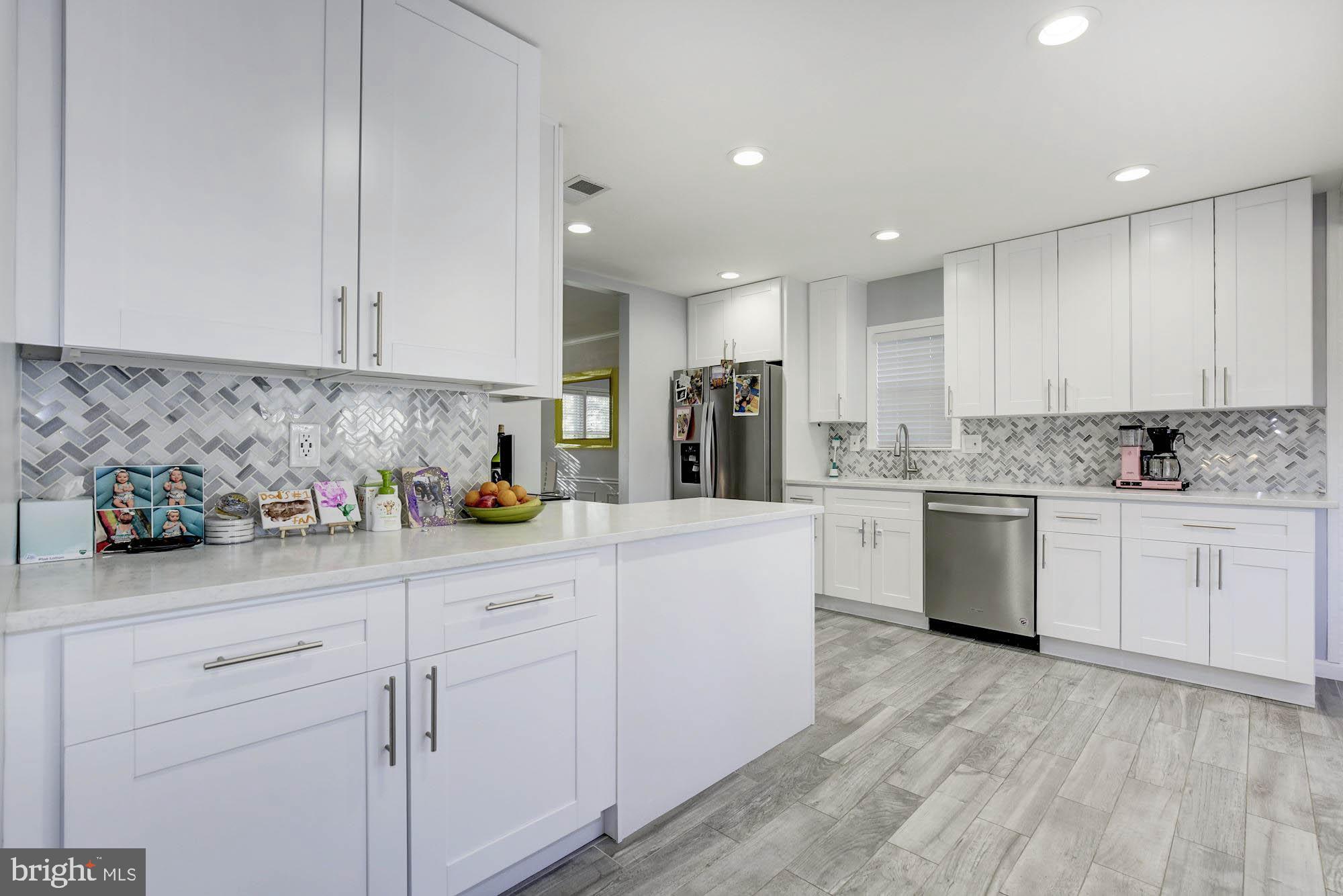 Showings will begin Sat July 6. Completely renovated, delightful, bright home. Deceptively larger than it looks. Recently painted, updated floors, bathroom, renovated gourmet eat-in kitchen, oversized screened porch, garage, large yard. Just a 10 out of 10!