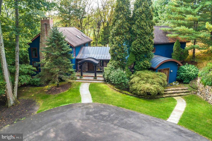 A pristine family compound discreetly hidden in a most desired area of Bucks County, just a short walk to the center of Carversville.  Set on 1.99 acres surrounded by 17 acres of preserved land, the main house was built in 2003 with reclaimed wood from an 1872 Bucks County barn and modern technological and green features. Architectural details include hand-made trusses, burnished plaster walls, polished concrete and barn wood floors, and extensive millwork. Built to maximize insulation, the main house is outfitted with a state of the art 10-zone heating system with radiant heated floors, a 3-zone air conditioning system that has ventilation and humidification systems that can run year-round with minimal consumption, and a HEPA air filtration system that continuously filters the air to assure premium air quality throughout the home. A central vac system services all areas of the house. Solar panels collect and provide power for electrical usage in the house, and, in the event of a power outage, a propane-powered generator automatically restores power to all essential systems. The large chef’s kitchen featuring top of the line appliances and the lovely breakfast room lead to a back mahogany deck and brick patio, an outdoor BBQ area, and the heated, salt-water swimming pool with waterfall. The family room/den off the kitchen features warm barnwood walls and a vaulted ceiling, as well as a large mezzanine area accessed by spiral stairs that can function as an office, library, or game room. The formal living room with an inviting gas fireplace and beautiful, functional built-ins and a large entry foyer/sitting room both have stunning views looking out over the property and also both lead out to the back entertaining space. There is a dramatic formal dining room featuring a cathedral ceiling, 19th C. wood flooring, and Venetian plaster walls. Completing the first floor is a guest suite, with a brick wood-burning Rumford fireplace and a barnwood full bath; a second bedroom or office; and a half bath. Upstairs is the Master Suite that features an intricately carved wood-burning Rumford fireplace, ample walk-in closets, a dressing room, and a full bath.  On the lower ground level there is an additional bedroom and full bath, a large second living room that leads out to the side yard of the house, a wine closet, and a kitchenette – all of which can be converted into a separate in-law suite or used as additional entertaining space, a home theater, gym, or guest suite. In addition to the three ensuite bedrooms and the additional bedroom/office in the main house, above the detached two-car garage there is a bedroom, two full baths, and a large living room.  Further up the driveway, there is a two-story approved accessory building, built in 2009, in the style of a barn, that contains a living room, an office, a full kitchen with high-end appliances, and upstairs a large bedroom and loft space with vaulted ceilings and breathtaking views. Two full bathrooms, a washer/dryer, plenty of storage, and an additional two-car garage complete the barn. This family compound is truly for the discerning buyer who appreciates quality and thoughtful design.
