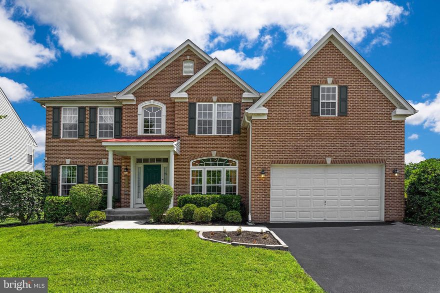 Beautiful 5,024 SQFT home with finished basement appt perfect for in-law(s)!  Nestled in a quiet family-oriented community, this home features an open floor plan on all 3 levels with a total of 6 bedrooms, 3.5 Baths.  The updated gourmet kitchen has all stainless-steel appliances, granite counter tops, gas cook top, icemaker/filtered water dispenser, double oven, large kitchen island leading into the over-sized sunroom with ample natural lighting.  The sunroom features a view overlooking the community lake w/ walk/jog path.  The backyard has large paver patio and spacious yard.  Great room has vaulted ceiling, stone covered gas fireplace w/ mantel, brand new hard wood flooring, 5.1 flush mount surround sound system and large windows w/ ample natural light.  4 bedrooms upstairs all have walk-in closets. The Primary bedroom has his and hers walk-in closets, primary bathroom w/ separate vanities, shower, jetted soaking tub, ceramic tile flooring and large sitting room.  Living room and formal dining room have crown molding and bay windows.  Double/dual staircases, security system and whole house sprinkler system.  A/C and heating system w/ forced air/electric. Fully Finished walk-out basement with 2 bonus rooms, which can be used as office, den or storage room, kitchenette.  PERFECT for In-Law Suite!!