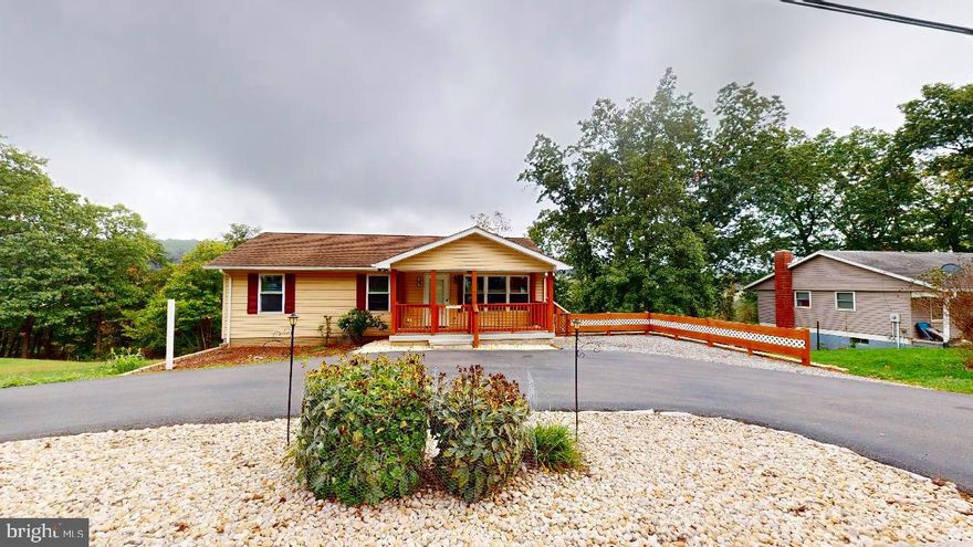 Looking for a quaint little town to call your own?  This location is close to all one needs with easy access to WV RT 50 which leads to Winchester Va for additional shopping, hospital and work options.   There are many little extras this home has to offer.  Laundry hook up on the main level or the room can easily be converted back to a 3rd main level bedroom, office or a combo of each.  There is also a laundry room on the lower level that can also contain extra appliances if needed.  A 3rd/4th  bedroom has also been used on the lower level with the 2nd full bath.  Family room and plenty of storage areas.  The large back porch is a much see. Family gatherings with plenty of privacy and farm field view.