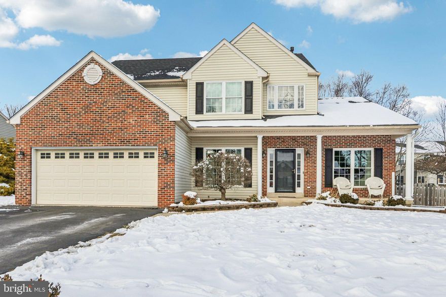 Freshly painted from top to bottom, this beautifully maintained Cassel Mill Colonial at 702 Daniel Drive offers 4 bedrooms, 2.5 baths, and 2,519 square feet of living space above grade, plus an additional 600 square feet of finished basement. Hardwood floors welcome you through the foyer and continue into the kitchen, formal living room, and dining room, where crown molding, chair rail, and a tray ceiling create an elegant setting for everyday living and entertaining. The family room is centered around a cozy gas fireplace, while a private office or den just off the foyer provides an ideal work-from-home space. A convenient mudroom with laundry and direct garage access helps keep daily routines organized. Upstairs, the primary suite is accessed through double doors and features a walk-in closet and a spa-inspired en suite bath with a soaking tub, walk-in shower, and skylight. Three additional bedrooms share a well-appointed hall bath with double sinks. The custom finished basement, completed in 2023–2024, adds versatile living space with egress, a dedicated storage area, and a sump pump—perfect for recreation, guests, or hobbies. Outdoor living includes a covered front porch and a hard-scaped patio overlooking the fenced backyard. Notable improvements include six vinyl front windows (2019), hardwood flooring in the living and dining rooms (2019), a 50-gallon water heater (2021), replaced fencing (2022), the custom finished basement (2023–2024), and a new roof installed in October 2025. 702 Daniel Drive is a place you will love to call home!