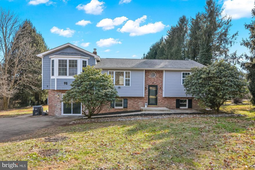 If you’ve been searching for a peaceful place to unwind, this charming 4-bedroom, 2.5-bath bilevel home could be the one. Tucked away on a quiet back road and surrounded by mature trees and open space, it offers privacy and a true sense of country living—while still providing easy access to major roads and everyday conveniences.

Inside, the home feels fresh and inviting with new paint and flooring throughout. The main level features a bright living area that flows into an updated kitchen with granite countertops, ample cabinet space, and all appliances included. A walk-in pantry with a sliding door adds great storage, and a door off the kitchen leads directly to the back deck and yard.

One of the home’s standout features is the spacious 24 x 14 sunroom, designed for year-round enjoyment. Filled with natural light and warmed by a gas fireplace, it’s the perfect spot to relax, entertain, or simply take in the peaceful surroundings.

The main-level primary bedroom offers comfortable single-floor living with a his & her closets and a private bathroom featuring a tiled walk-in shower. The lower level provides three additional bedrooms with generous closets, a full bathroom, and a cozy family room—ideal for guests, recreation, or extra living space. A convenient full bath adds functionality to the lower level.

Outside, the property spans over an acre with both front and back yards, offering plenty of room to enjoy the outdoors. The multi-level deck includes a screened section with French doors and a ceiling fan, making it perfect for outdoor dining, morning coffee, or quiet evenings. A large storage shed in the backyard provides ample space for tools, equipment, or hobbies.

It comes complete with a whole house generator , newer HVAC system and owned solar panels. 

This home delivers space, comfort, and privacy in a tranquil setting—an ideal place to slow down, spread out, and truly feel at home