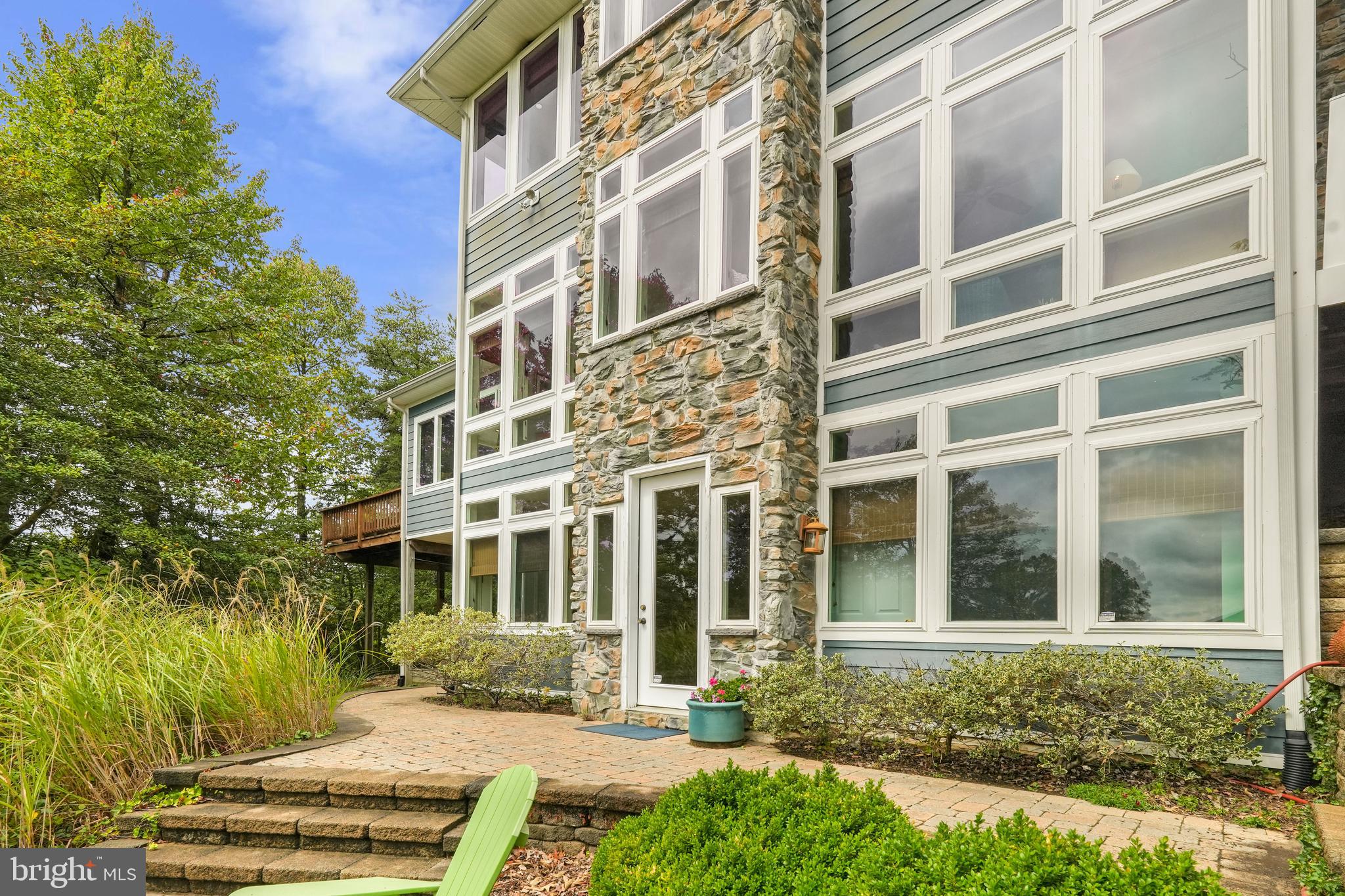 WHIMSICAL Craftsman-style WATERFRONT with sweeping panoramic WATER VIEWS in the Drum Point community of Calvert County MD! 3 Bedrooms, 3.5 bathrooms and 3 finished levels, all with incomparable views of Drum Point Lake, the Patuxent River and the Chesapeake Bay!
Welcome to 569 Beech Drive, a magnificent waterfront retreat within a private and wooded setting. Grand 8' glass-lit double doors welcome you into the main level foyer, where you'll be immediately enchanted by the open floor plan and the breathtaking water views. The gourmet kitchen showcases stainless steel appliances, stunning cabinetry reaching to the ceiling, granite countertops, and a spacious center island. This home features gleaming hardwood floors, an oversized gas fireplace with marble surround, and dual-zone HVAC with gas backup for energy efficiency. The sunroom features two walls of windows and two skylights, creating an inviting space for relaxation, entertainment, and cherished family gatherings. A main level bedroom provides private access to a full bath and leads to a secondary deck with privacy and picturesque lake views. The home features 8' doors and 9' ceiling heights throughout. The main level also offers a pantry with upper and lower cabinetry and a convenient powder room with a pocket door. The upper level is a true owner's sanctuary, with an open, spacious bedroom filled with natural light. The water views from the owner's bedroom are astounding! The owner's bath is generously sized, featuring a stand-up shower and dual vanity sinks, while across from the bath is an extra-large walk-in closet. Don't miss the lighted, hardwood staircase to all 3 levels, which is a stunning piece of architecture on it's own. The basement is finished with hardwood flooring & offers a walkout exit, a full bedroom, a finished full bathroom, a recreation room, and additional storage/mechanical room. Step outside the basement onto a beautifully hardscaped paver patio with retaining walls, providing a perfect vantage point to take in the lake, river, and bay views. Recent updates include new carpet in all carpeted areas and fresh paint throughout. Parking is a breeze with a 2-car garage and a stone paved driveway that offers plenty of off-street parking. There is also walkout storage space with exterior access that is expansive, perfect for storing equipment, machinery, and water toys, including kayaks and canoes. Direct lake access from the property and a road with parking for community access to a private beach, the Chesapeake Bay, and the Patuxent River provide for an exceptional waterfront lifestyle. Conveniently located near local shopping, restaurants, and dining options, as well as close proximity to major commuter route 4, making commutes to PAX Naval Base and Calvert Cliffs Power Plant ideal. Calvert County Schools and Lusby Town Center are also nearby. For water enthusiasts, the Mill Creek Marina is just a short drive away. Additionally, the Drum Point Clubhouse general membership is exclusively available to Drum Point property owners & provides access to amenities such as a fishing and crabbing pier, a fire pit, a meeting room with a smart TV, and supports land conservation efforts at Drum Point. This property offers a rare and exceptional combination of views and access to all three bodies of water: Drum Point Pond, the Patuxent River, and the Chesapeake Bay. Don't miss the opportunity to make this waterfront paradise, surrounded by private, wooded beauty, your new home! Schedule your showing today!