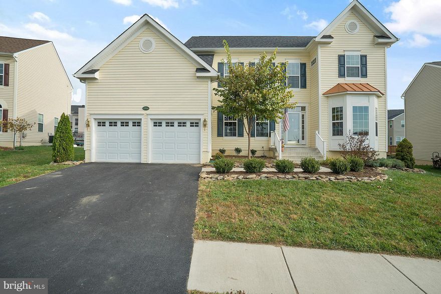 Only 3 years young! Fantastic Longstreet model with new hardwoods on entire main level, stairs, upstairs hall and master bedroom! Shows beautifully with custom paint and an open, modern feel.  Kitchen with dark stained cabinets and granite. Faces a large open space park, no one will build there. Rear yard fully fenced with patio. HOA features lake access! This home is truly special!