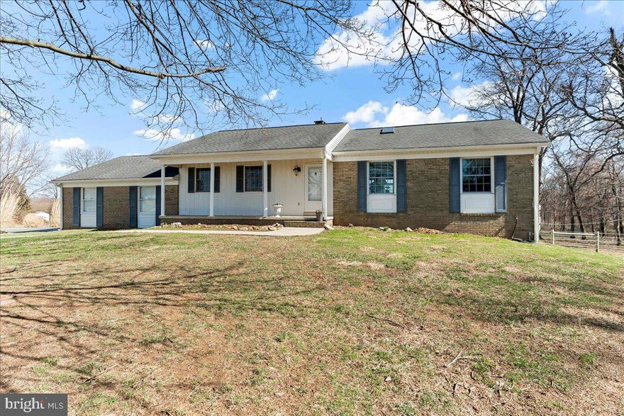 Unveil a truly exceptional property offering the best of both worlds: a beautiful appointed primary residence and a separate rental home on nearly 20 acres. The primary home boasts a welcoming front porch leading to soaring cathedral ceilings and an expansive living area anchored by a stone wood burning fireplace. The chef-inspired kitchen, featuring abundant cabinetry, generous counter space, and a substantial island, is perfect for entertaining. A dedicated office or flex space enhances the first floor's versatility, while the primary suite offers a spa-like retreat with a luxurious bath, separate walk in shower, and custom closet organization. A sun-drenched three-season room, with deck access, provides breathtaking views of the riding ring and stables and lets the outside in. The finished lower level expands your living space with an additional bedroom, full bath, flexible living area (convertible to a bedroom), a fitness room complete with a sauna, and a convenient laundry area with exterior access. A spacious two-car garage includes a staircase to ample storage. Outside, a charming gazebo overlooks the riding ring, and a barn with five stalls, powered by owned solar panels for utility-free living for the barn and main house. The 40x72 barn has substantial lighting with fluorescent lights and lots of room for storage and equipment. Along the property is a stream. The new owners can benefit from reduced taxes under Act 319, the Clean and Green Program.. At the property's entrance, discover a separate, modular ranch home, ideal as a guest house, in-law quarters, or a rental. This home features its own driveway, well, septic, utilities, and a two-car garage on a fenced acre lot. Inside, find three bedrooms, two baths, a galley kitchen, dining room, and a spacious living room with a brick fireplace. Basement access is provided through bilco doors, and the roof was recently replaced in 2023. This vacant home offers immediate income potential or flexible living arrangements. Discover this rare opportunity! Search on Youtube “537 MEDIA RD TOUR” for virtual tour!