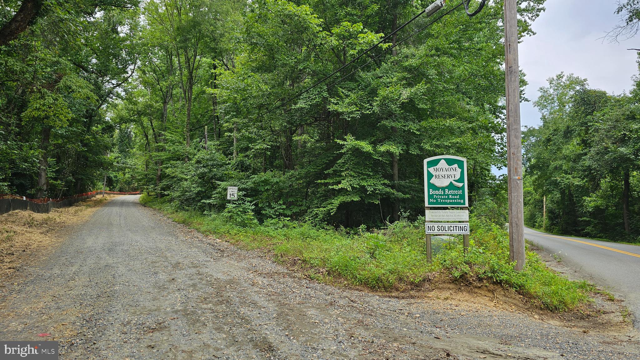 SOLD AS-IS! BEAUTIFUL, WOW, AMAZING, SCENIC vacant land in the wooded sought after Moyaone Reserve. Build your DREAM HOUSE today on 7.31 acres of land with nature-made benefits that are hard to come by. Located across the Potomac River (Virginia)/Mt. Vernon. Owners have access to the community center, pool, playground covered pavilion, outdoor kitchen, picnic area, basketball court and playing fields. There are trails for hiking and biking, sites for kayaking and canoeing. There is an as-is dilapidated goat shack on the land. MUST SEE! MUST HAVE! Feel free to drive by and take a look at the land and/or schedule a tour TODAY. SOLD AS-IS!