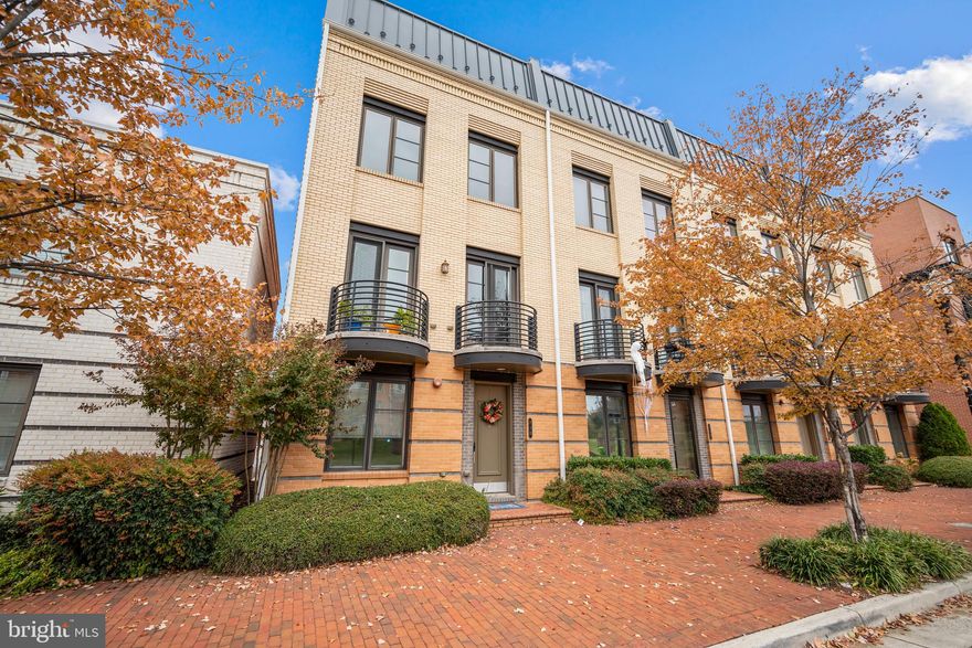 Live in the heart of Potomac Yard! This stunning 4-level contemporary townhome offers sophisticated urban living with exceptional space and style. The heart of the home features a chef's kitchen with sleek white cabinetry, elegant granite countertops, a stunning mosaic tile backsplash, and stainless steel appliances including a modern range hood. The open-concept design flows seamlessly into the spacious living and dining areas, bathed in natural light from expansive windows and highlighted by beautiful hardwood flooring throughout. Step out to your private deck, the perfect spot to enjoy your morning coffee or dine al fresco. Upstairs, discover the primary bedroom suite with a luxurious en suite bathroom with double vanity and granite countertops. A second generously sized bedroom and full bathroom round out this level of the home. The top level loft offers a versatile bonus space ideal for a home office or playroom, plus a large storage closet and direct access to your private rooftop deck. Imagine entertaining guests or unwinding with sweeping views of the neighborhood and beyond! The entry level offers a third bedroom with full bathroom, and a flexible living space perfect for a home gym, family room, or private guest space, with direct access to the attached 2-car garage for secure, convenient parking and storage. Modern finishes throughout include recessed lighting, contemporary ceiling fans, stylish barn doors, ample storage, and in-unit laundry. Just minutes to Wegmans, Target, Potomac Yard, Amazon HQ2, Reagan National Airport, Old Town Alexandria, Pentagon, and downtown DC. Quick access to I-395, Route 1, and the Potomac Yard Metro Station make commuting effortless. Experience elevated Potomac Yard living - schedule your private showing today!