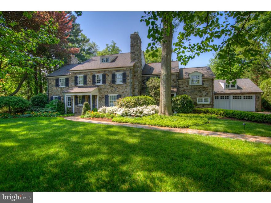 Located on one of the most beautiful streets in Haverford, this classic stone colonial home combines the elegance and charm of the Mainline. Follow the flagstone walkway surrounded by lush landscaping to the picturesque entrance of this meticulously maintained home. From the moment you enter into this timeless foyer with its gleaming random width peg hardwood flooring, you know you have entered a special home.  An expansive formal living room is to the left of the entryway, with a gas fireplace, deep window sills and French doors which lead to the garden room which is surrounded by windows and doors leading to the flagstone terrace. The formal dining room, with its huge bay window, easily accommodates a table for twelve.  Off of the entry to your right, is the study with a gas fireplace, deep window sills, built-in bookcases and pocket doors. A powder room is also located off of the foyer. Enter into the heart of the home. The expansive kitchen features a huge island, granite countertops, Wolf oven and range, Sub Zero refrigerator, wine refrigerator, abundant cabinetry and storage, and a desk/computer area. The butler's pantry off of the kitchen has its own Sub Zero refrigerator with more cabinetry and counter space.  The breakfast room is surrounded by floor to ceiling windows overlooking the backyard. Off of the kitchen is the spacious, recently renovated family room.  This gorgeous room with its vaulted ceiling looks like it is straight out of a magazine!  The windows and French doors fill the room with natural light.  The large gas fireplace completes the room. Located on the second floor is the large Master bedroom, with an attached sitting room and its own balcony that overlooks the parklike setting of the backyard. A marbled floor ensuite master bath includes double sinks/vanities, a whirlpool soaking tub, and glass shower. To complete the room is the marvelous closet with built-in shelving.  Down the hall, two large sunlit bedrooms on the front of the house, share a Jack and Jill classic white tiled bathroom. Another large bedroom is across the hall with its own recently renovated bathroom with glass shower. The third floor features another bedroom and marble bathroom with stall shower. Head downstairs to the tiled floor basement with a fireplace and built-in bookcases and shelving for a large TV.  A beautifully crafted temperature controlled wine cellar will be the envy of all and the perfect place to store your wine collection!