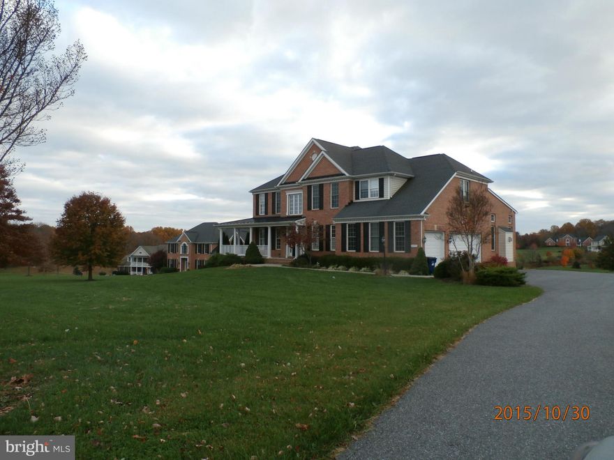 Great location for easy commute Baltimore, Hunt Valley, Rt 32. Gourmet kitchen, granite counters, wood flooring, 3 bay garage.    Master bedroom with sitting room, bath has tub and separate shower, dual vanities, walkin closet Bedroom 2 & 3 jack and jill bath bedroom 4 private bath.  Unfinished basement walk out to nice yard.  Drive by you will see the value.  Buyer pays 300 fee at closing.