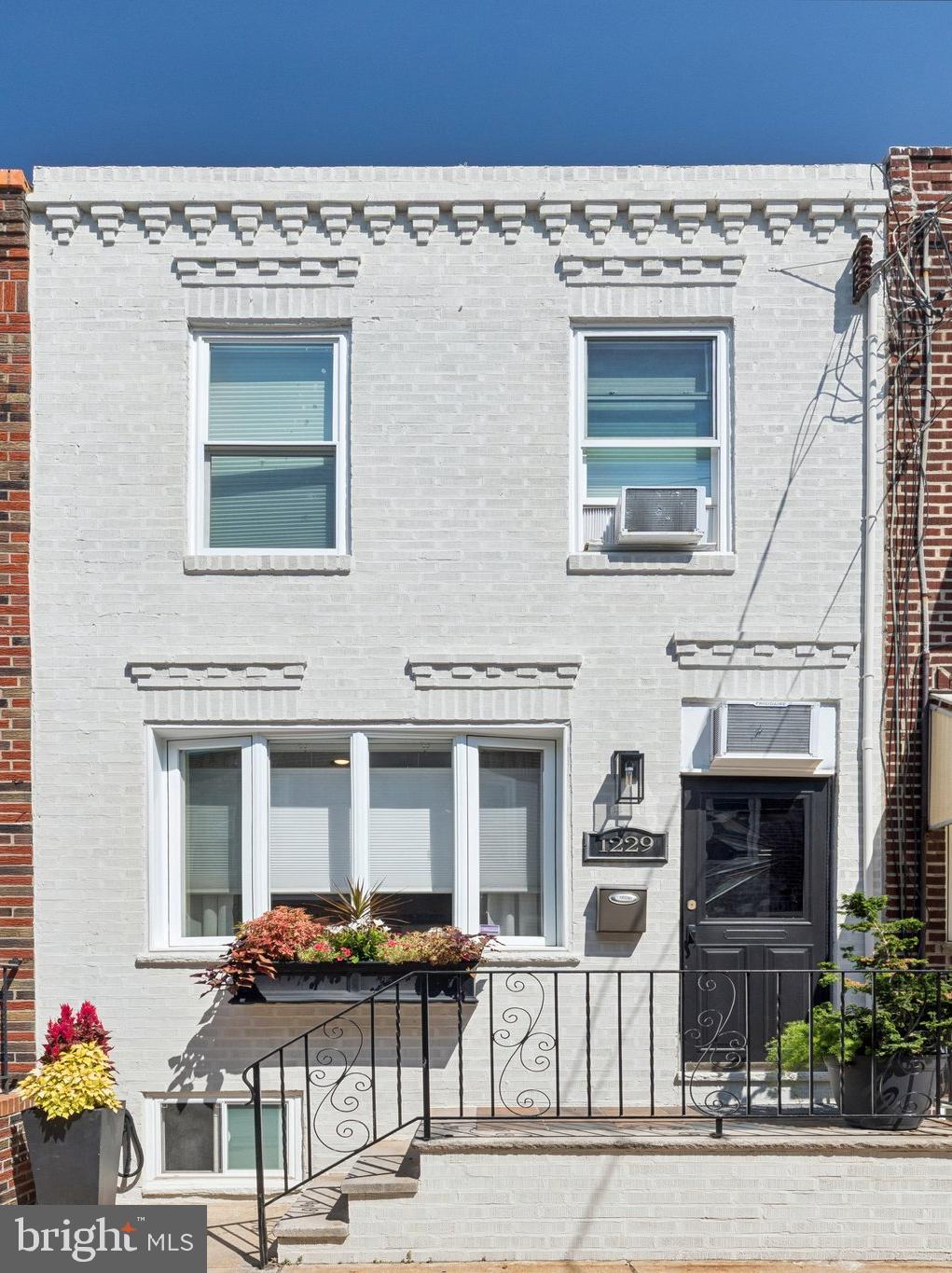 Charming & Move-In Ready Home in the East Passyunk Location
Step inside this beautifully updated South Philadelphia row home and feel the warmth of modern comfort blended with classic charm. This home has been thoughtfully upgraded throughout, offering a move-in ready experience for its next owner.
On the first floor, brand-new hardwood floors create an inviting flow from the living room to the dining area, while the restored staircase and original Tofanni door pay homage to the home’s character. The freshly painted front and kitchen cabinets add a crisp, welcoming feel, complemented by newer appliances and a new kitchen faucet.
Upstairs, enjoy brand-new carpeting, new windows in the bedrooms, and updated sheet-rocked walls in one of the bedrooms for a clean, polished finish. The bathroom features a regulated tub, a new vanity, and a new medicine cabinet, bringing modern convenience to your daily routine.
Other key upgrades include:
New radiator covers and a brand-new furnace for efficient heating
New ceiling fans all throughout for added comfort
Roof coating for peace of mind
New closet doors for easy storage
One of this home’s best features is its private backyard oasis — a cozy, low-maintenance outdoor space perfect for morning coffee, container gardening, or entertaining friends under the shade.
Located on a quiet, neighborly street just minutes from Passyunk Avenue’s vibrant shops, restaurants, and cafés, this home offers easy access to Center City, sports arenas, public transportation, and all the best of Philadelphia living.
If you’re looking for a home with historic charm, thoughtful updates, and a private outdoor retreat in a prime location, 1229 Emily Street is ready to welcome you.