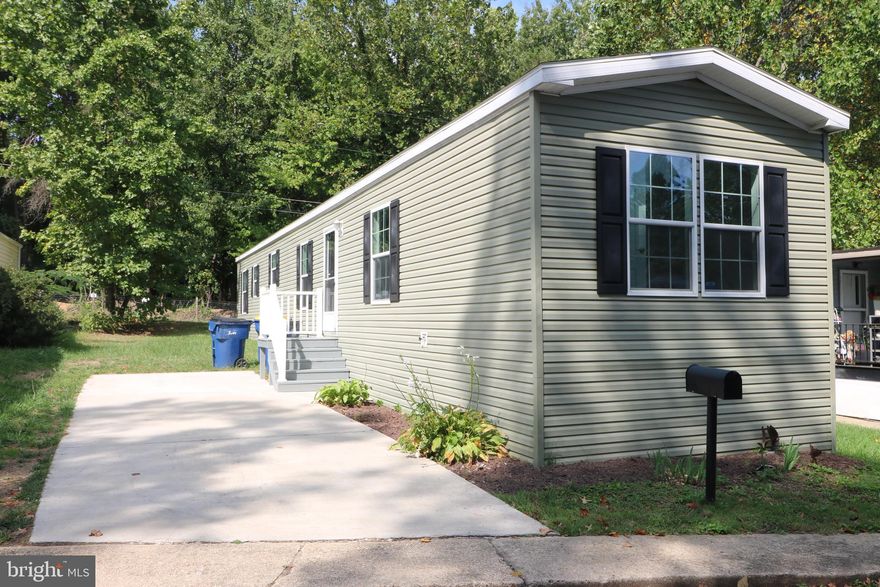 BUYER UNABLE TO OBTAIN FINANCING, AVAILABLE AGAIN! GROUND RENT IS $960.00 A MONTH. Welcome to this beautifully remodeled home, originally manufactured in 2019. Featuring 8-foot ceilings, this home boasts brand-new kitchen cabinets, sleek stainless steel appliances, 3 spacious bedrooms, and 2 full bathrooms. It offers convenient parking with a driveway for two vehicles, plus additional street parking. Ground rent is $960.00 per month.