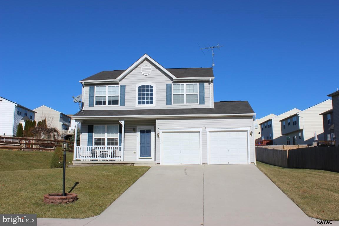 Immaculate two story with wood floors, gas fireplace, 2 car garage, hardscape patio, and neutral tones. Pride in ownership is obvious throughout. Basement has rough in for bath and walk-up to the rear yard. Come take a look.