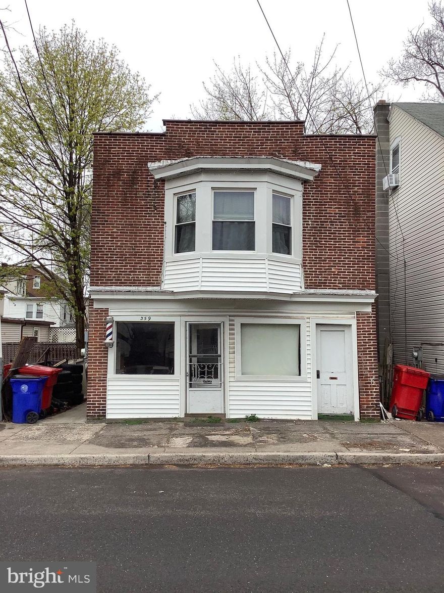 Excellent opportunity to run a small business and collect rental income, or live upstairs and run your business below.  Either way, opportunity abounds!  The possibilities are endless with a store front 1st floor with additional space to the side.  Start your business with low taxes, low overhead, PLUS additional income potential from apartment rental.  It's a win-win-win!