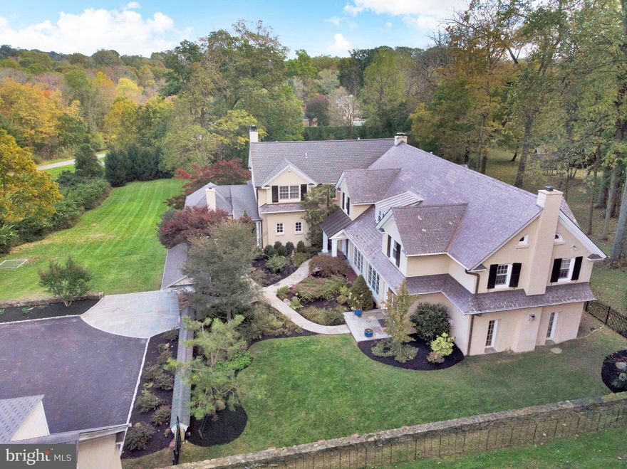 Rarely does an extraordinary residence as this come along that blends refined historic elements & aesthetics with a modern layout & amenities. 538 Sugartown combines the advantages of both a classic gem & a new house, and has a wonderful story. The original wing was fully custom-built by a New York tycoon with top materials that are hardly used today. Distinctive features reflecting its traditional elegance are stone piers & walls, a front courtyard & garden, slate roof, high wood-beamed ceilings, and billiard room with antique oak doors, hardwood cabinets & gas fireplace. A total renovation of the house yielded a new wing as well, built in 2006 by a famous TV host. This addition provides all the contemporary conveniences today's family desires, such as an open family room with coffered ceilings & fireplace for relaxing nights, a spacious master suite with a large sitting room, his/her closets & a balcony for watching stunning sunrises, master spa bath with a jetted tub & shower, his & her studies with picturesque views & a hidden wine cellar, a generous deck & screen room for dining, reading & enjoying nature, and a sunny open finished walkout basement with a recreation/playroom, media room, wet bar & full bath. Current owners have made extensive updates since 2012 including a new driveway entrance with real stone piers & walls, new garden by an award-winning designer with a new patio, plants & drainage system, new golf putting range & Tee box for practicing your swing, new wine cellar for your favorite vintages, new high-efficiency boiler & a complete repainting of the interior/exterior. The expansiveness felt the moment you enter the gracious foyer is enhanced by tall airy ceilings & rich wood floors. Abundant oversized windows bring the outdoors in, show gorgeous views & invite in brilliant light throughout. Formal living & dining rooms, a sunroom overlooking scenic gardens, den with a stone wood-burning fireplace, custom wet bar & patio doors, and a seamless flow between the kitchen, family room, breakfast room & outdoor spaces provide a perfect backdrop for entertaining. This home is in a class of its own, made for large families with 5 well-sized bedrooms (including 2 master suites), 4.5 baths (2 with jetted tubs), laundry, 4-zone HVAC & more. Set far back on a large lot & hidden from the road for incredible tranquility & privacy, with a variety of plants, flowers, birds & wildlife; yet convenient to top schools & local amenities!