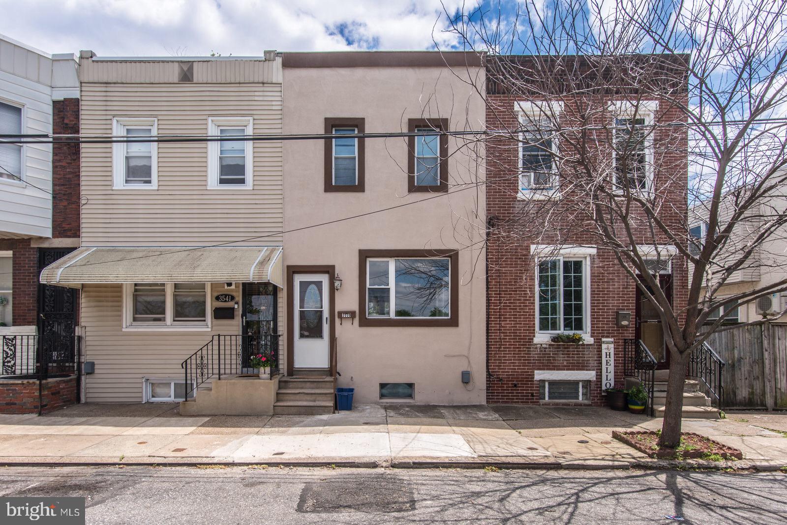 3539 Almond Street, located in the heart of Philadelphia’s vibrant Port Richmond neighborhood, is a charming and beautifully renovated townhouse that effortlessly combines historic character with modern amenities. The open-concept first floor features gleaming hardwood floors, recessed lighting, and ceiling fans, creating a warm and welcoming atmosphere. The kitchen is outfitted with high-end solid wood cabinetry, granite countertops, a stylish glass tile backsplash, and Frigidaire stainless steel appliances—perfect for any home chef. Upstairs, the home offers three comfortable bedrooms with plush new carpeting and ample closet space, while the updated bathroom showcases elegant porcelain tile and decorative glass accents. A finished basement provides additional living space ideal for a family room, home office, or workout area, and includes a convenient laundry section. Outside, a private fenced-in backyard offers the perfect space for entertaining or relaxing. The property also features updated systems, including new electrical service, an energy-efficient hot water heater, and HVAC units, ensuring year-round comfort. With on-street parking and a location close to shopping, dining, and public transportation, this move-in-ready home is a fantastic opportunity in one of Philadelphia’s most up-and-coming neighborhoods.