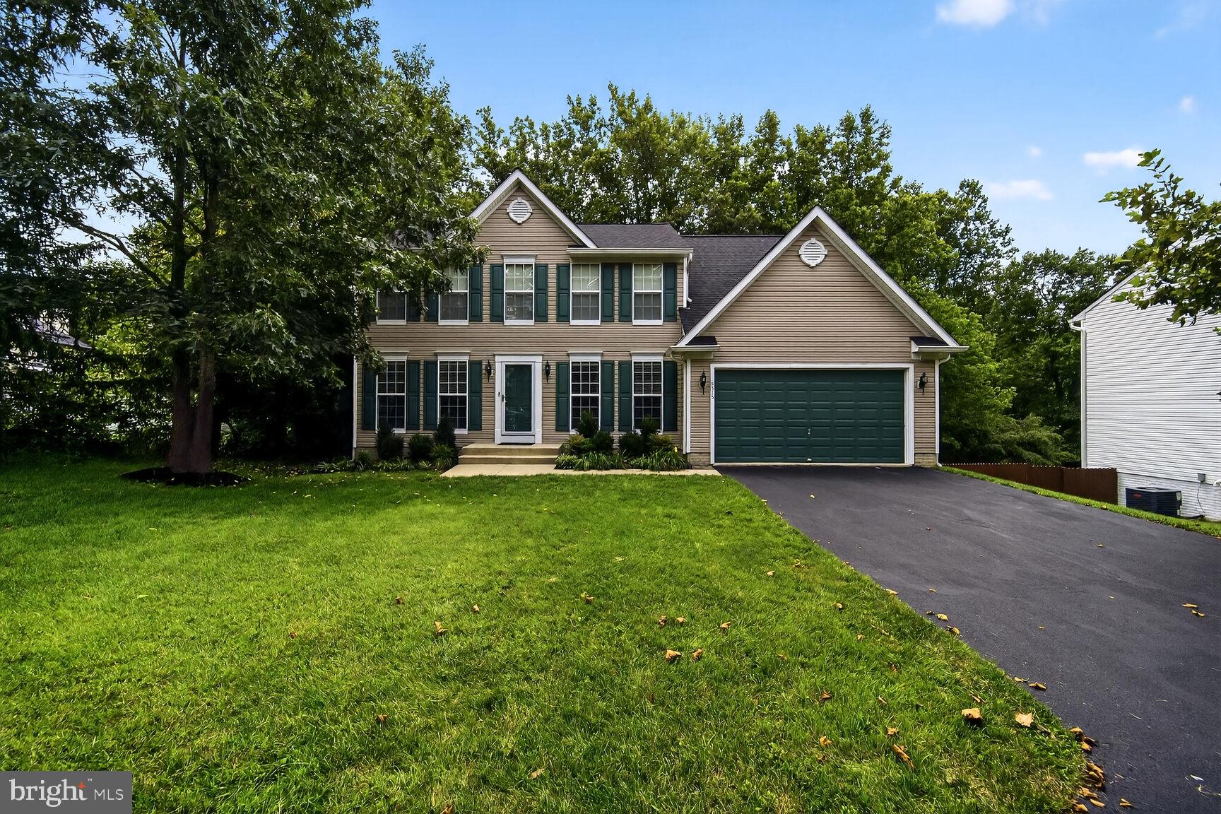 Welcome to this stunning 4-bedroom Colonial with over 3,200 square feet of living space, ideally located on a private pipestem in the highly sought-after community of Thornton Woods.
From the moment you arrive, you’ll appreciate the well-manicured landscaping and freshly sealed, extended driveway. Step inside to a dramatic 2-story foyer with gleaming hardwood floors that flow throughout the main level. To the right, you’ll find a spacious formal dining room, and to the left, a sun-filled formal living room. Just off the center hall is a convenient powder room.
The heart of the home is the bright and airy gourmet kitchen, complete with granite countertops, stainless steel appliances, and large corner windows over the sink to enjoy beautiful backyard views. Sliding glass doors lead from the kitchen to an expansive deck overlooking the private, tree-lined yard. The kitchen opens seamlessly to a cozy family room featuring a gas fireplace and brand-new plush carpeting. A nicely sized laundry room with access to the 2-car garage completes the main level.
Upstairs, the expansive primary suite boasts cathedral ceilings, new plush carpeting, a custom walk-in closet with built-ins, and a luxurious updated bath with dual sinks, a soaking tub, and a separate shower with seamless glass doors. Three additional generously sized bedrooms—all with new carpet—share a full hall bath.
The walkout lower level offers French doors leading to a beautiful stone patio and a fully fenced, landscaped backyard with mature trees and a custom shed. The lower level is already plumbed for a full bath, giving you the perfect opportunity to create your dream space.
Freshly painted throughout and updated with new carpet and gleaming hardwoods, this home also offers peace of mind with a newer HVAC system, roof, hot water heater, and brand-new epoxy garage flooring.
Though tucked away in a quiet neighborhood, you’re just minutes from shopping, trails, dining, schools, entertainment, places of worship, the mall, and major commuter routes. Best of all—No CPRA!