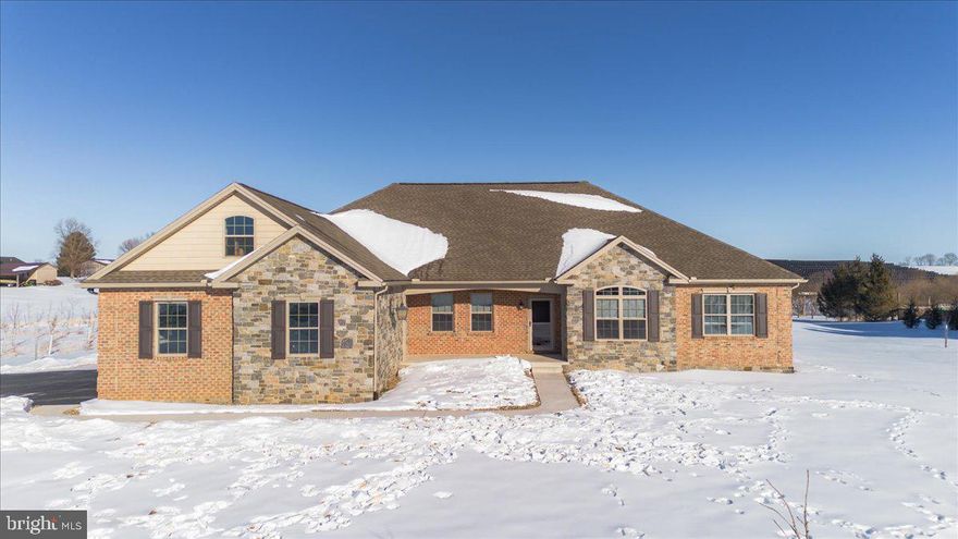 Like-New Rancher on 3 Acres with Mountain & Pastoral Views - Welcome to this stunning, nearly new rancher, just 4 years old and meticulously maintained, this home truly feels like new.   Features 3 bedrooms, 2 full baths & 2 half baths.  The open floor plan features 9' ceilings and a bright great room with beautiful wood floors and a cozy gas fireplace—perfect for everyday living or entertaining. The eat-in kitchen is a dream, offering granite countertops, a large center island, and all appliances included. Two dining areas provide flexibility for casual meals or formal gatherings.
The private primary bedroom suite is a peaceful retreat with a walk-in closet and a stylish en-suite bath featuring a walk-in shower, double vanity, and tile flooring. The second and third bedrooms are thoughtfully located on the opposite side of the home, offering privacy for family or guests.
French doors open to a dedicated home office with serene pastoral views—ideal for remote work or a quiet study.  Main-level laundry includes washer and dryer for added convenience.
Additional highlights include triple garage with workshop space, a walk-up attic heated & cooled and offers abundant storage or potential to convert into additional living space.  The finished basement has a spacious family room, second fireplace, half bath, and storage galore.  Even the crawl space is insulated and temperature-controlled—no detail overlooked.    Nice level lot, large back porch with view of 300+ trees planted for privacy in rear.  Peaceful country living with modern comforts, stunning views, and room to grow—this exceptional rancher checks every box.